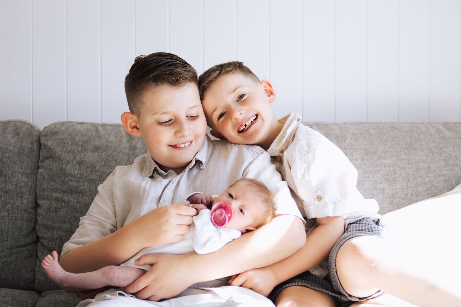 Brothers with newborn, sibling at home session