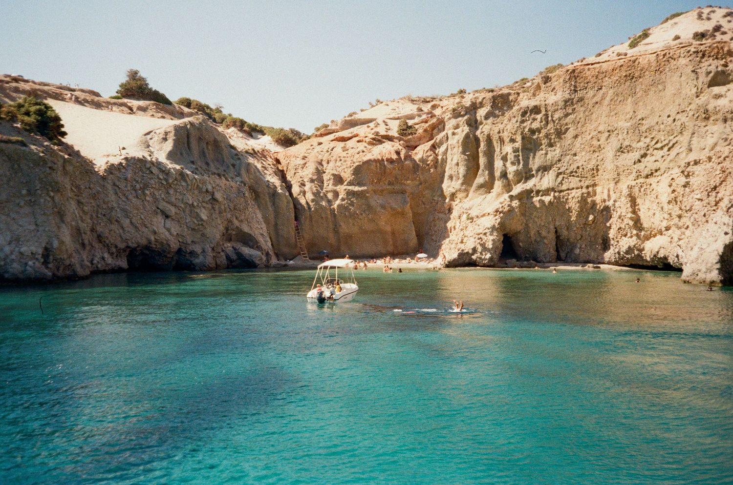 Scenic coastal cliffs and turquoise Mediterranean waters along the rocky shoreline of Malta's Blue Grotto.