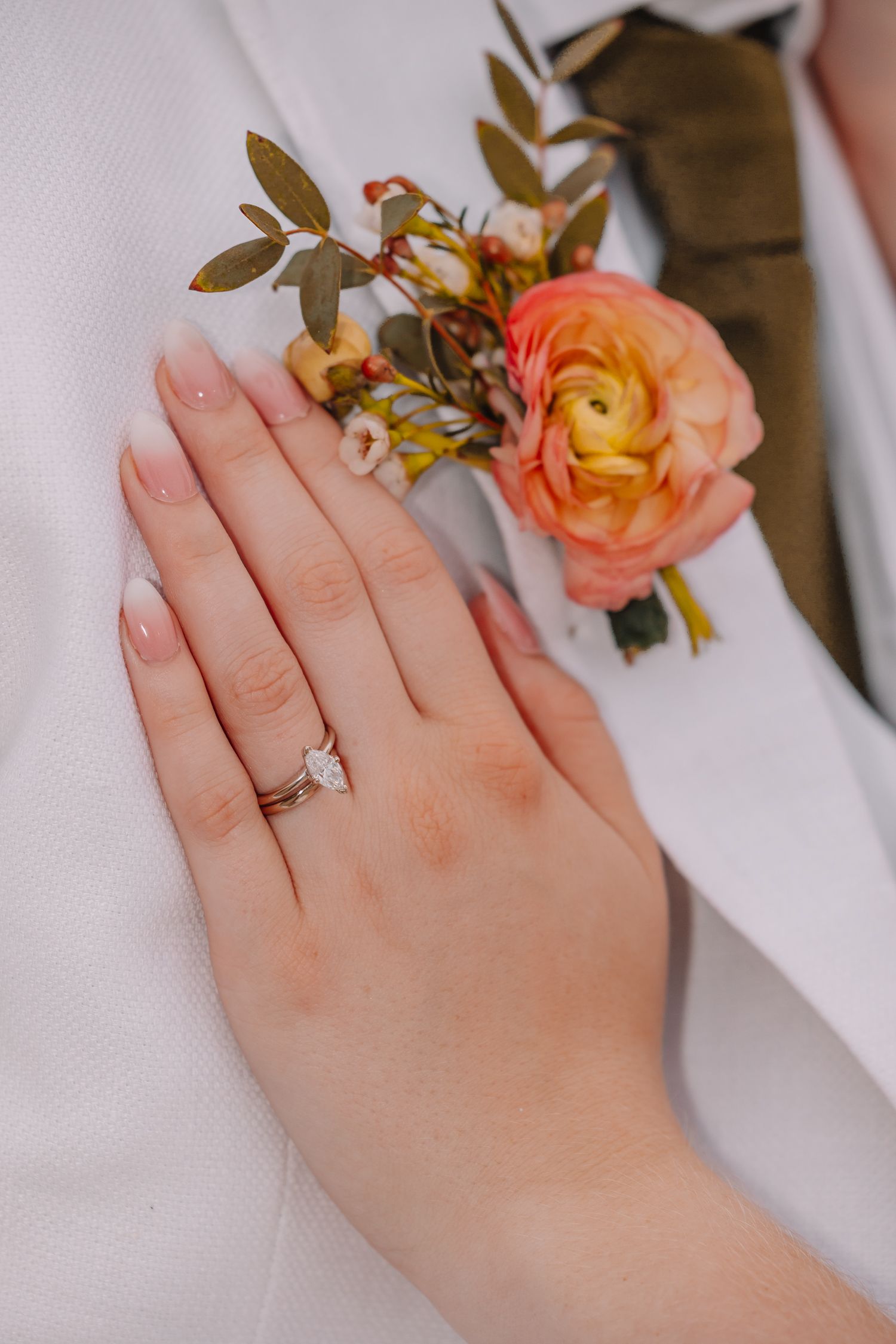Wedding Details Sentimental in Topeka, Kansas at the Brownstone.  Ring and Boutonniere.