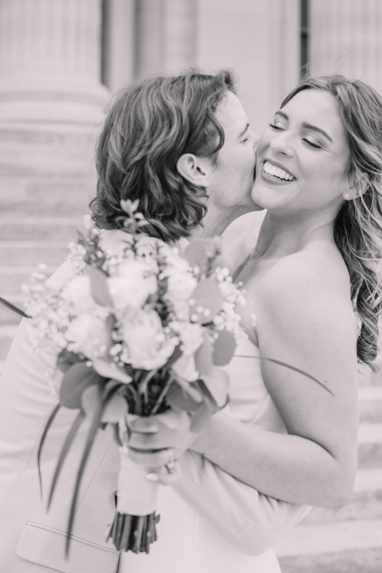 Romantic photo of bride and groom at the Topeka, KS Capitol. Wedding photos in Topeka, KS.