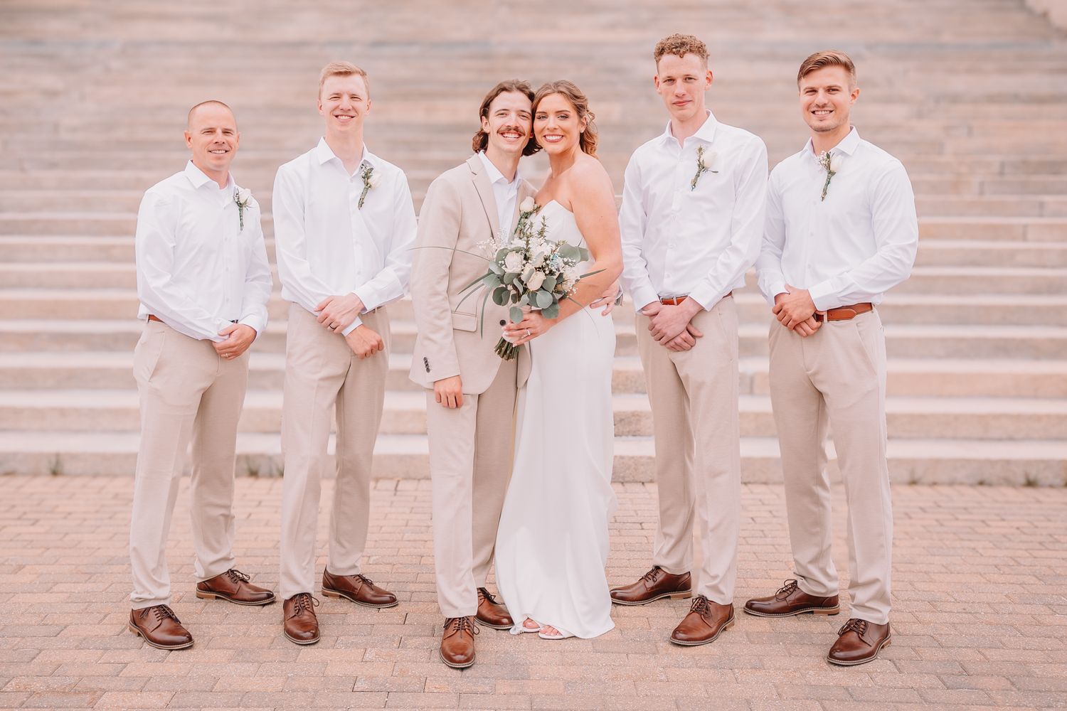Wedding Portraits at the Topeka, KS Capitol building. Wedding party Portraits. Bride and groom with groomsmen.