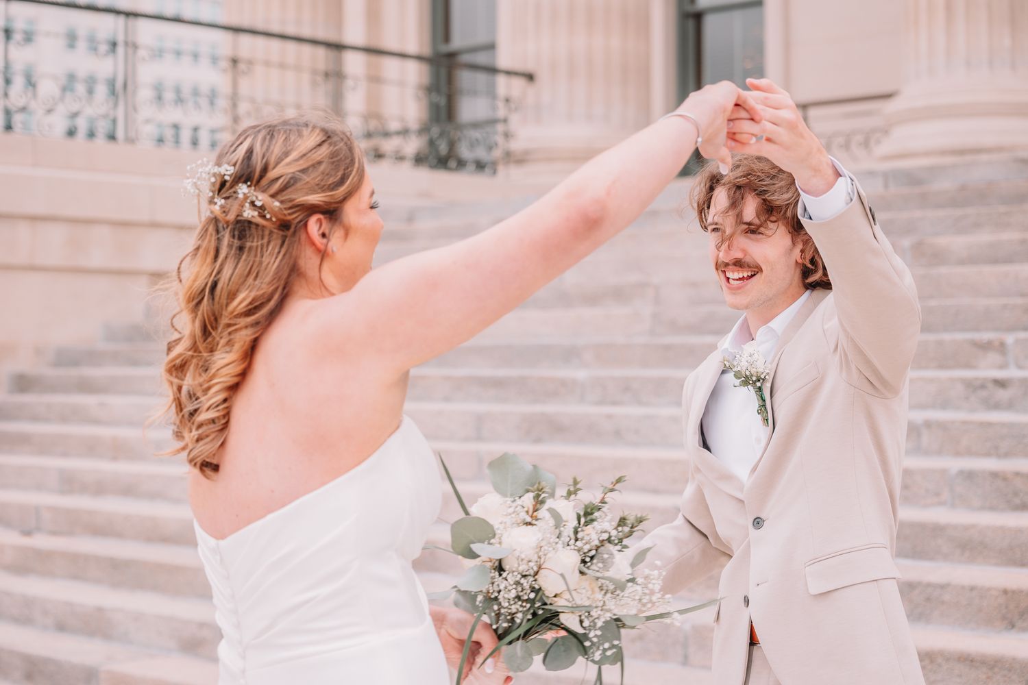 Romantic Wedding Photo of bride and groom at The Capitol building in Topeka, KS. First-look.