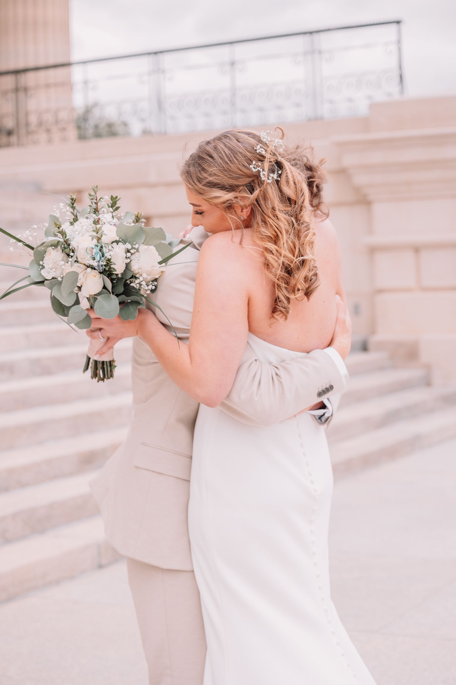 Romantic Wedding Photo of bride and groom at The Capitol building in Topeka, KS. First-look.