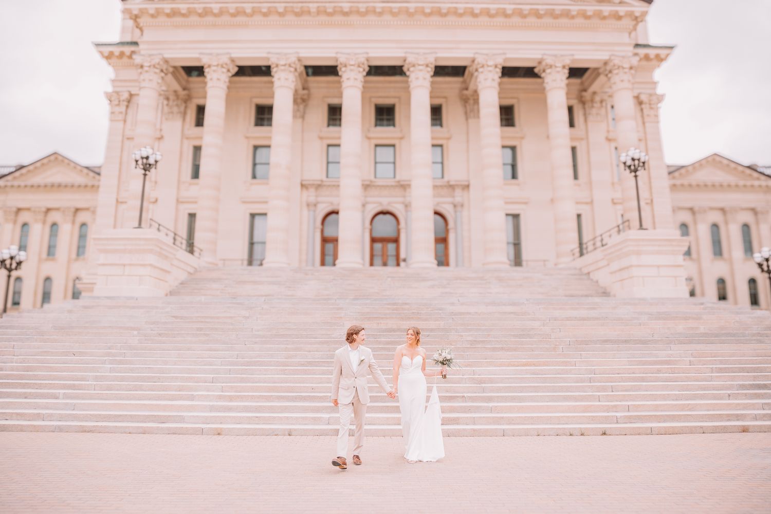 Romantic photo of bride and groom at the Topeka, KS Capitol. Wedding photos in Topeka, KS.
