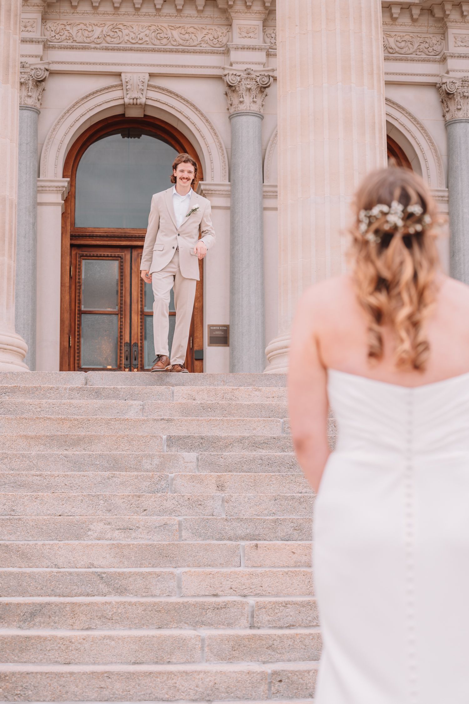 Romantic Wedding Photo of bride and groom at The Capitol building in Topeka, KS. First-look.