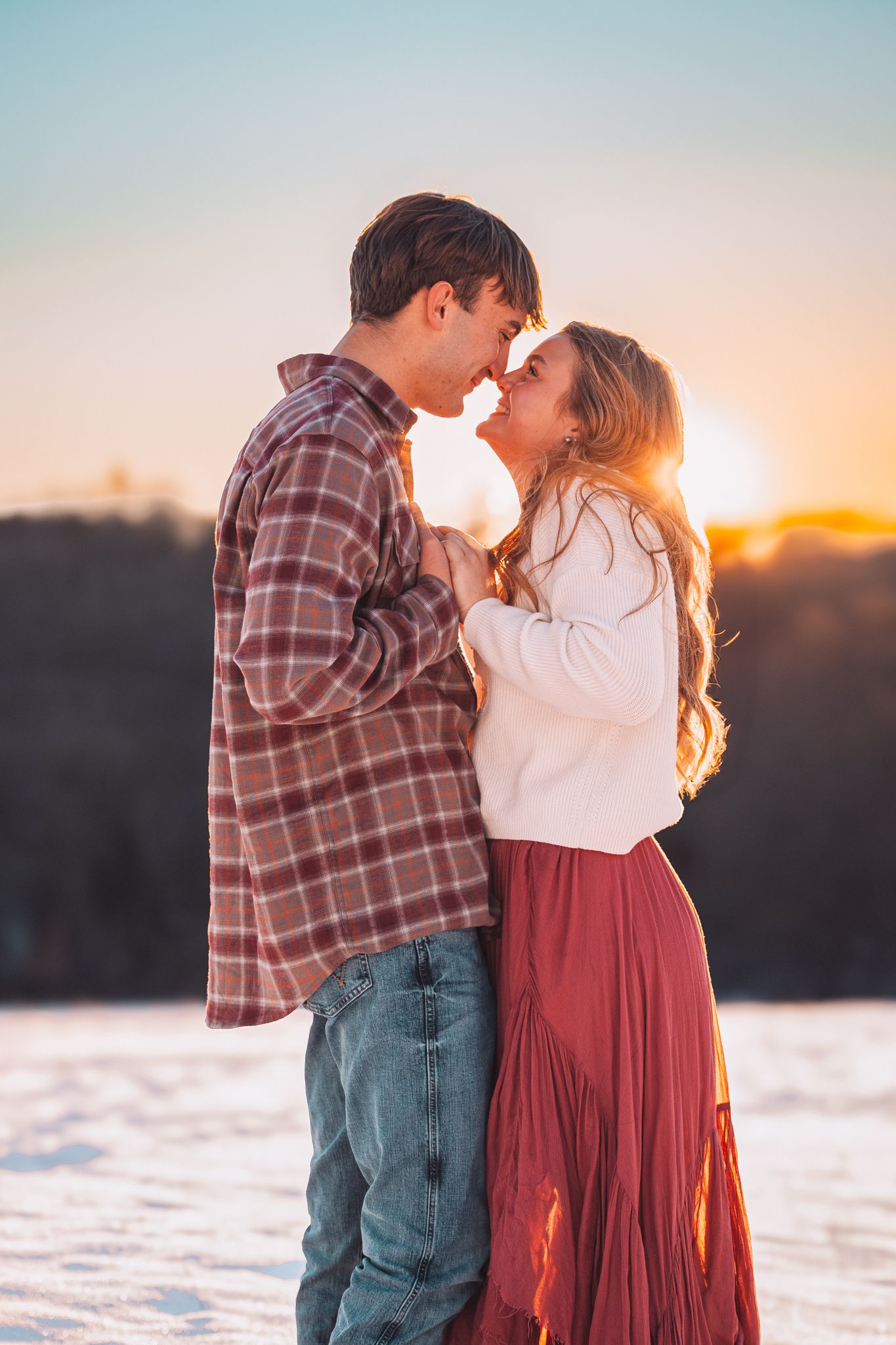 Romantic Couple's Photos in snow at the Governor's Mansion, Cedar Crest, in Topeka, KS at golden hour.