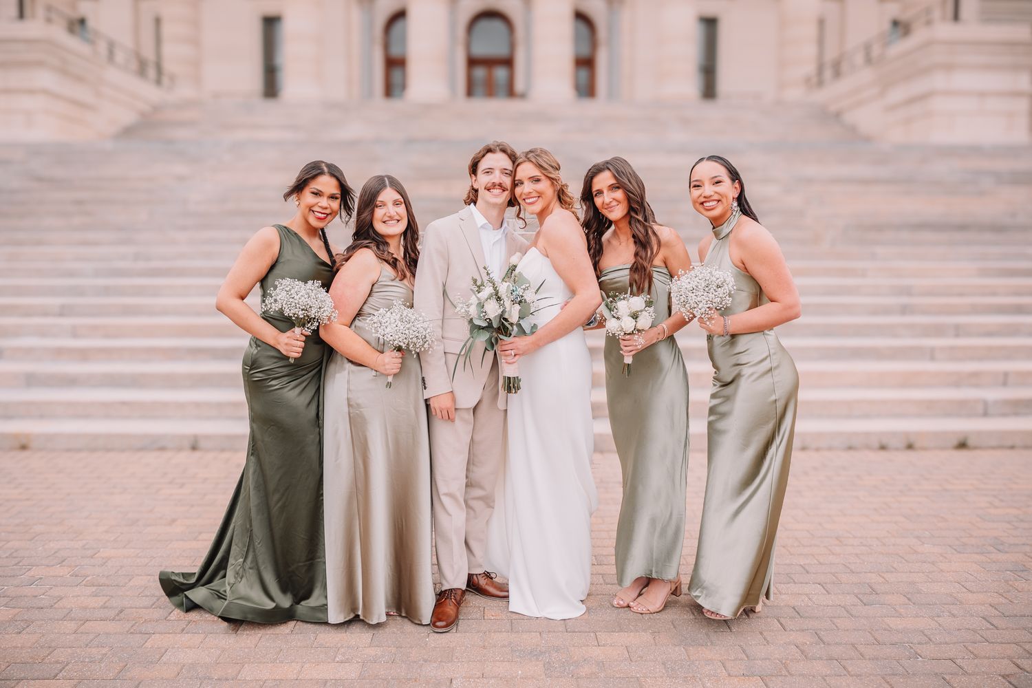 Wedding Portraits at the Topeka, KS Capitol building. Wedding party Portraits. Bride and groom with bridesmaids.