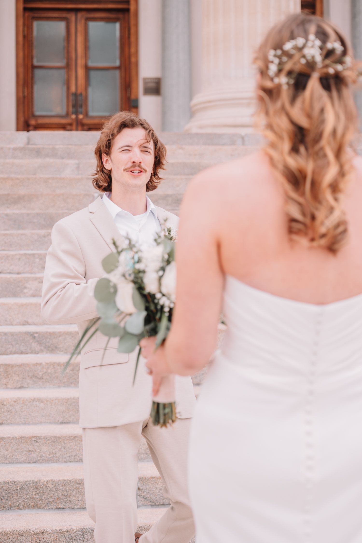 Romantic Wedding Photo of bride and groom at The Capitol building in Topeka, KS. First-look.