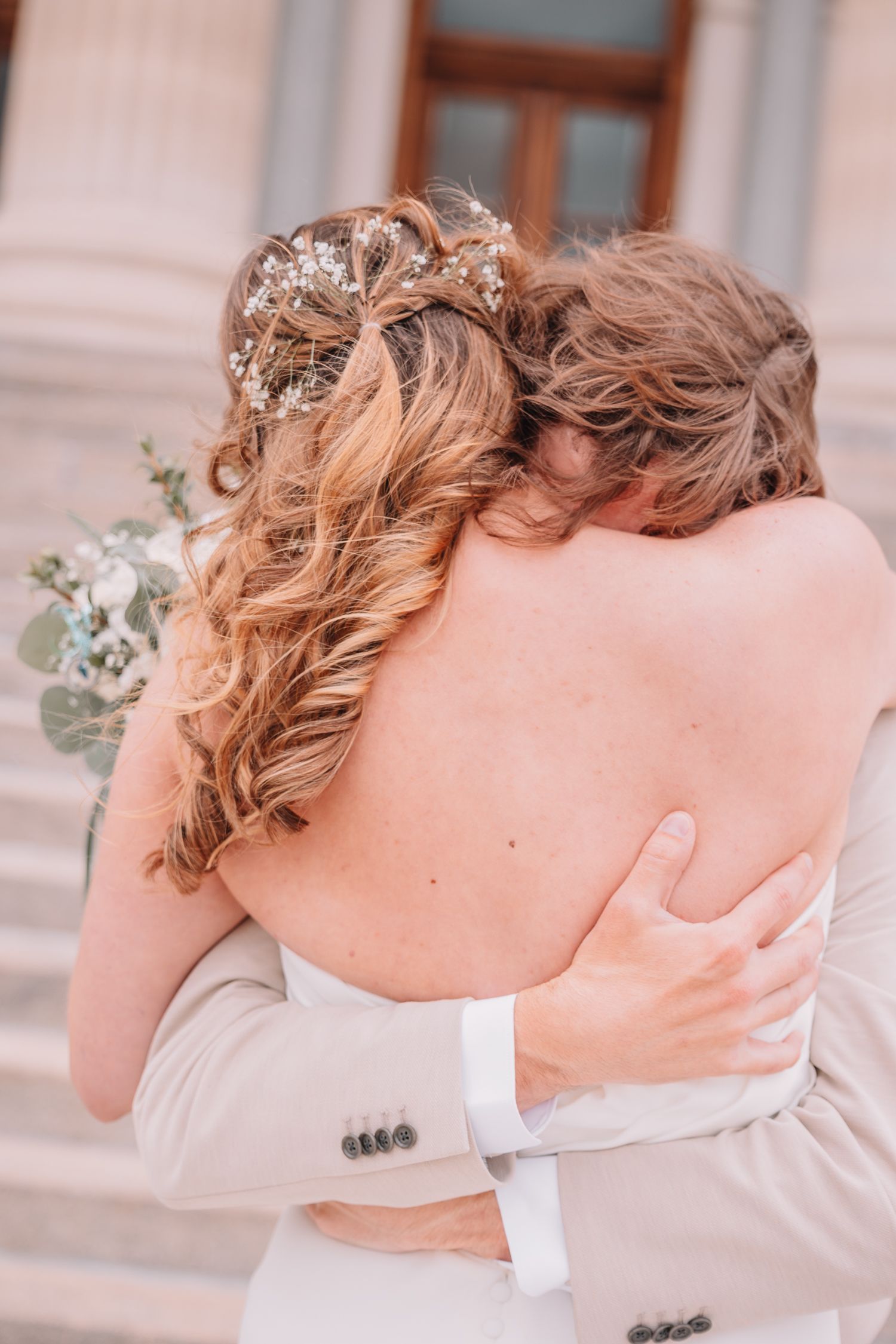 Romantic Wedding Photo of bride and groom at The Capitol building in Topeka, KS. First-look.