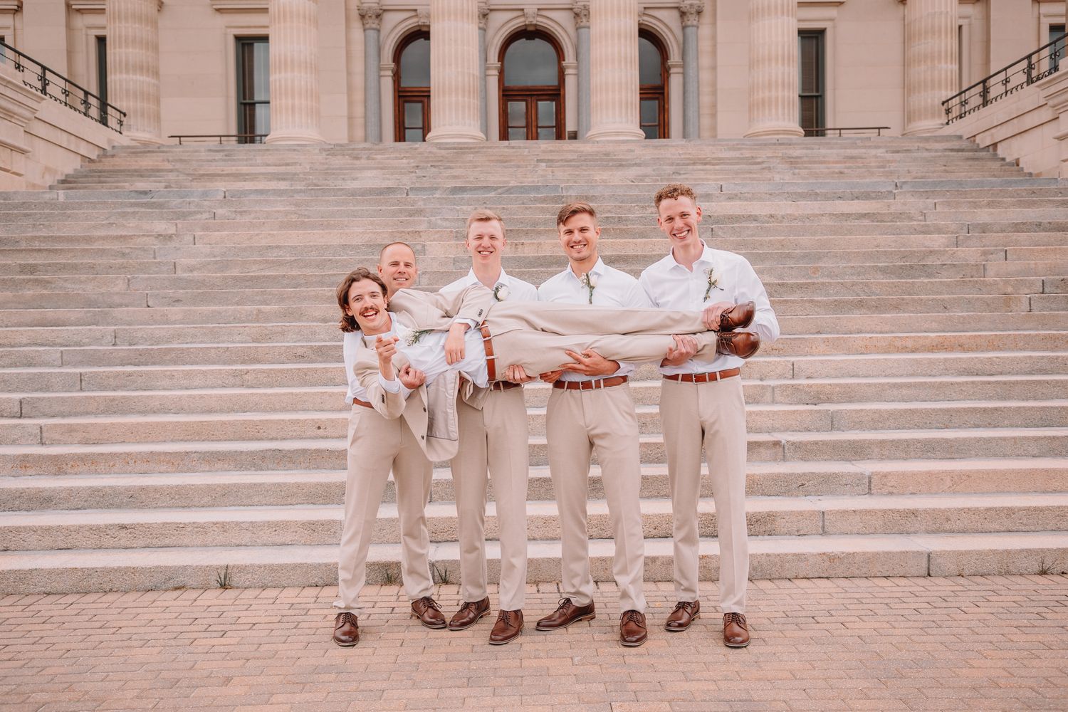 Wedding Portraits at the Topeka, KS Capitol building. Family Portraits. Bride and Family.