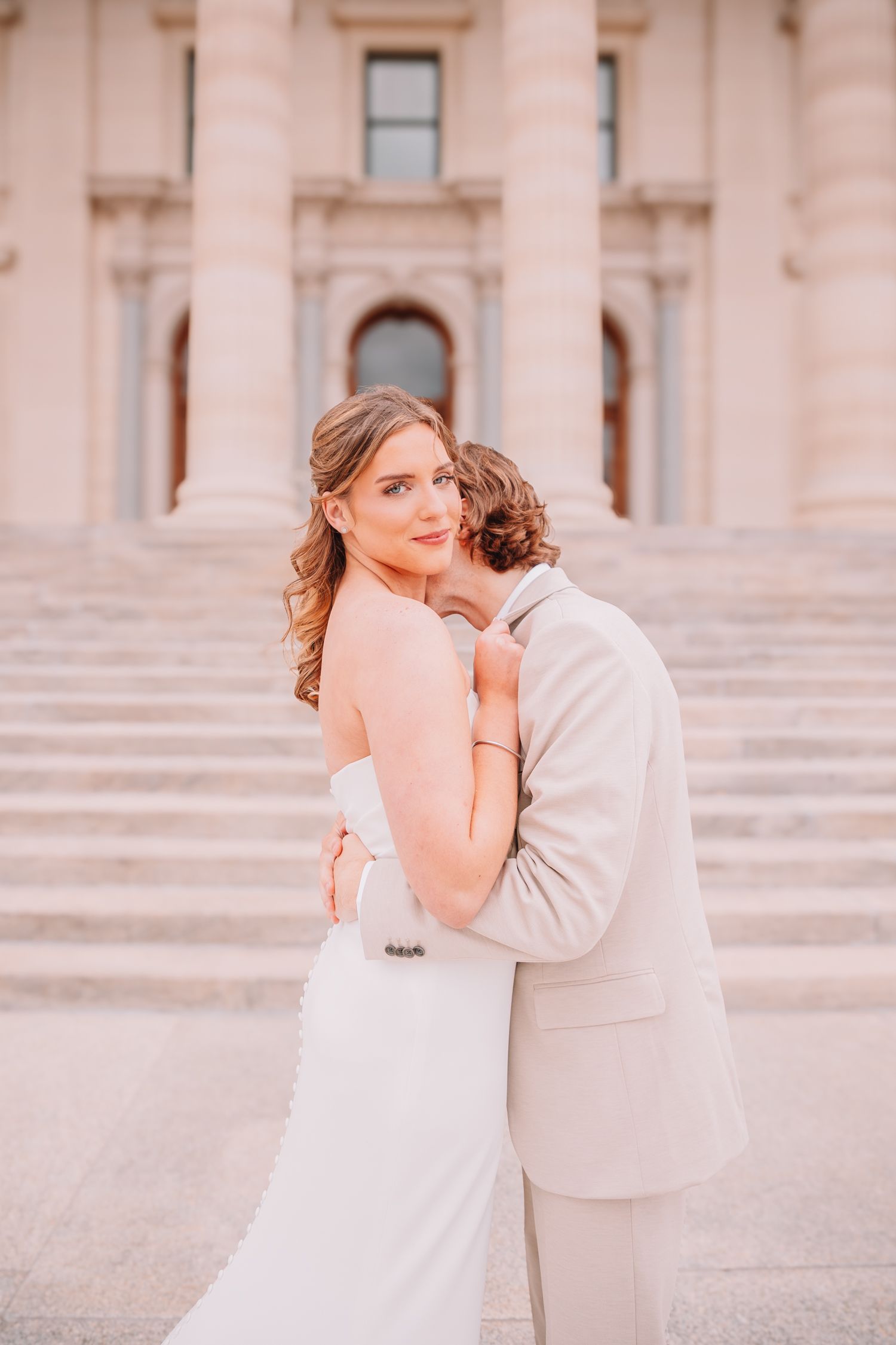 Romantic photo of bride and groom at the Topeka, KS Capitol. Wedding photos in Topeka, KS.