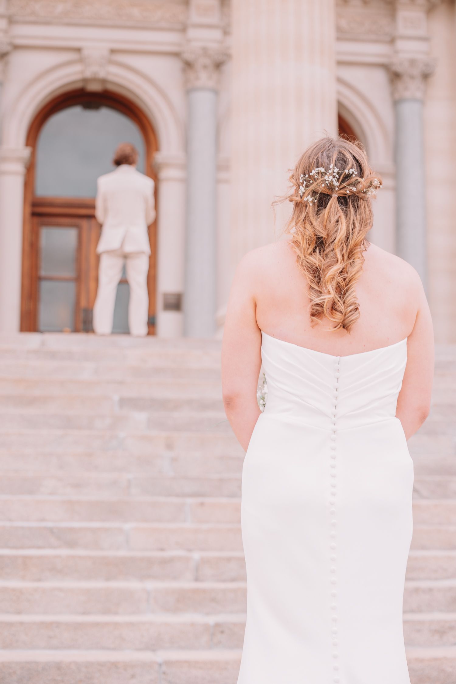 Romantic Wedding Photo of bride and groom at The Capitol building in Topeka, KS. First-look.