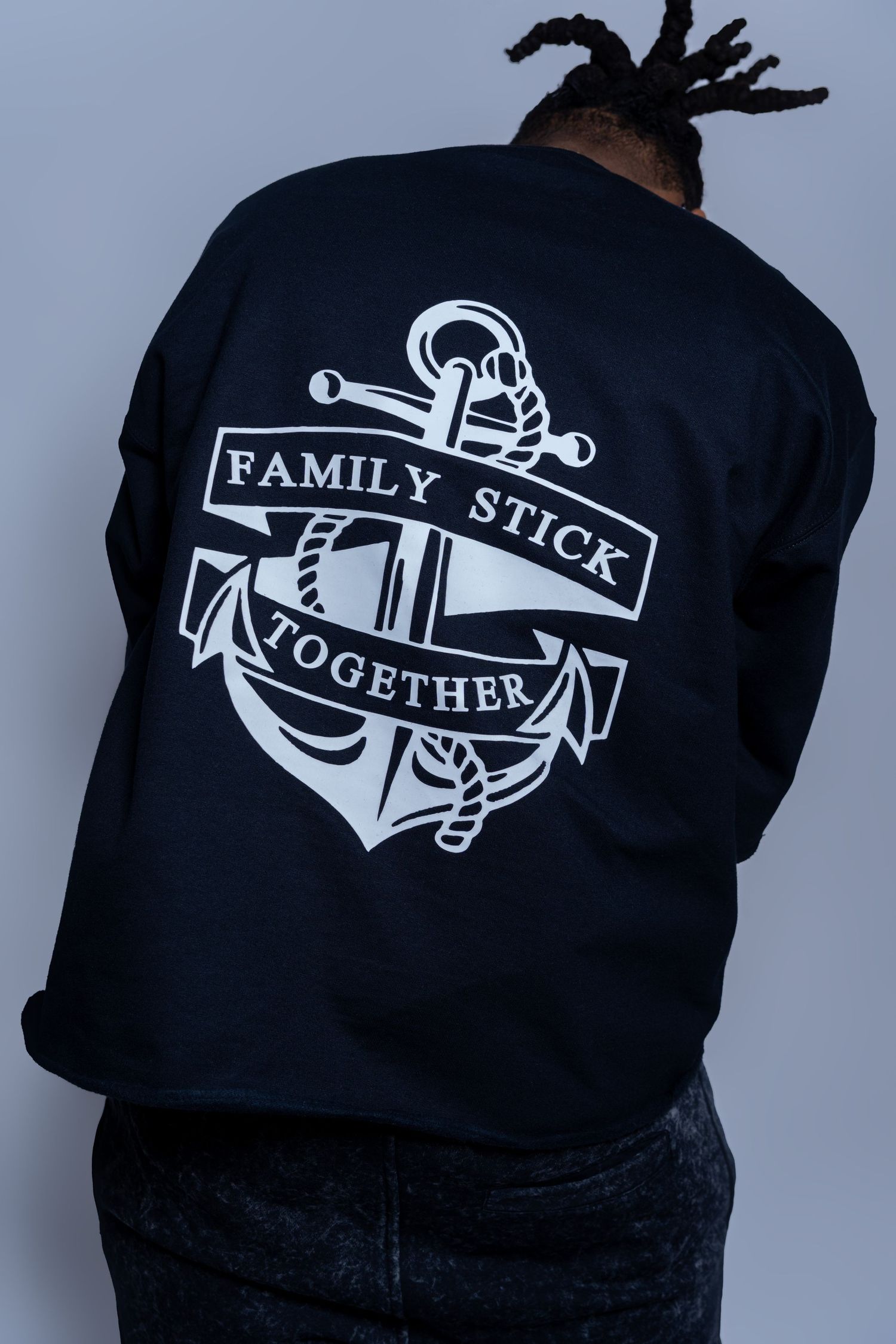 Black sweatshirt with white anchor graphic and Family Stick Together text on back.