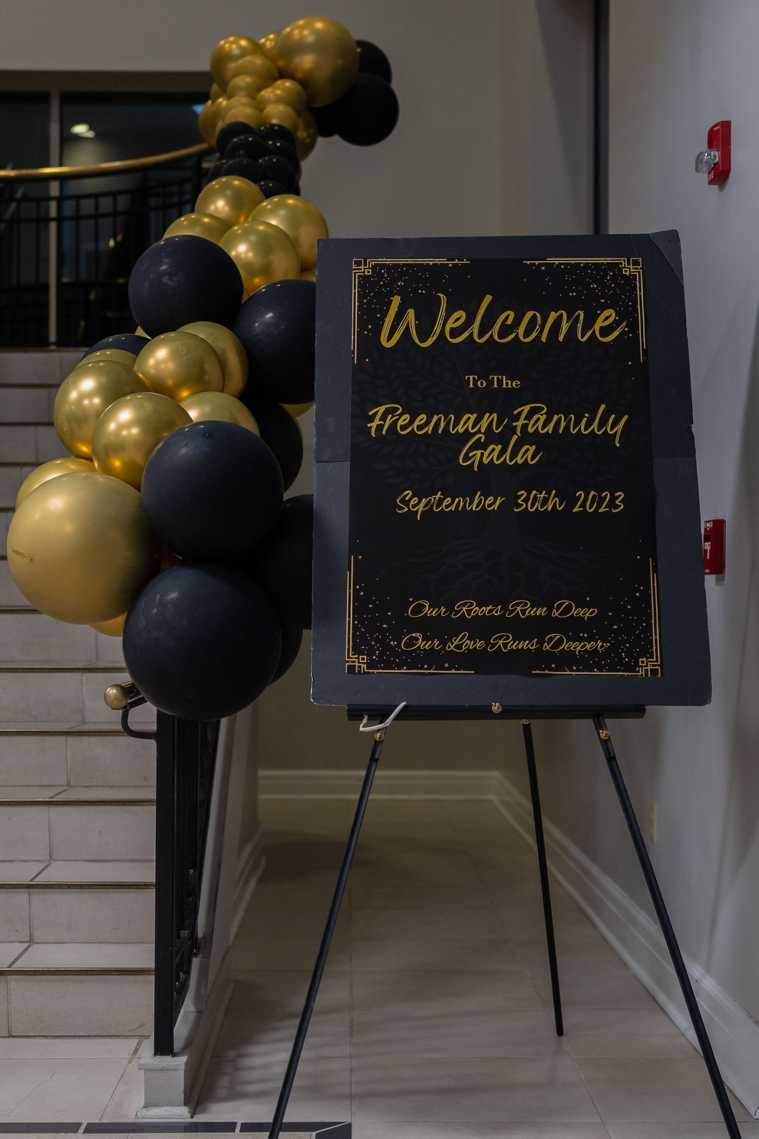 A welcome sign for the Freeman Family Gala on September 30th 2023 with gold and black balloons.