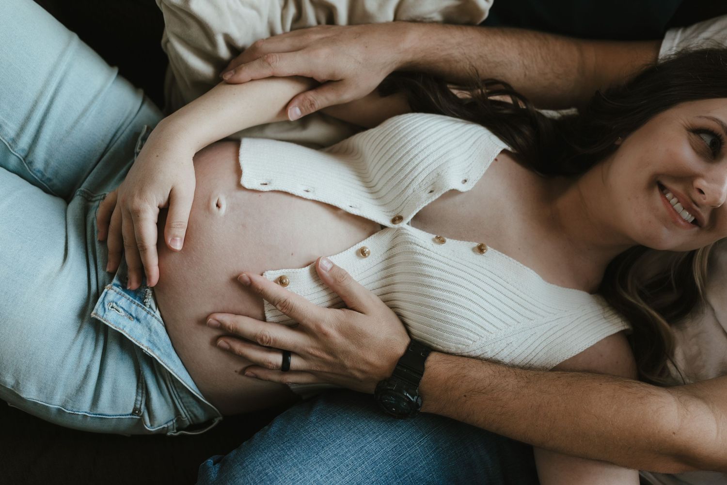 indoor maternity photos close up of baby bump