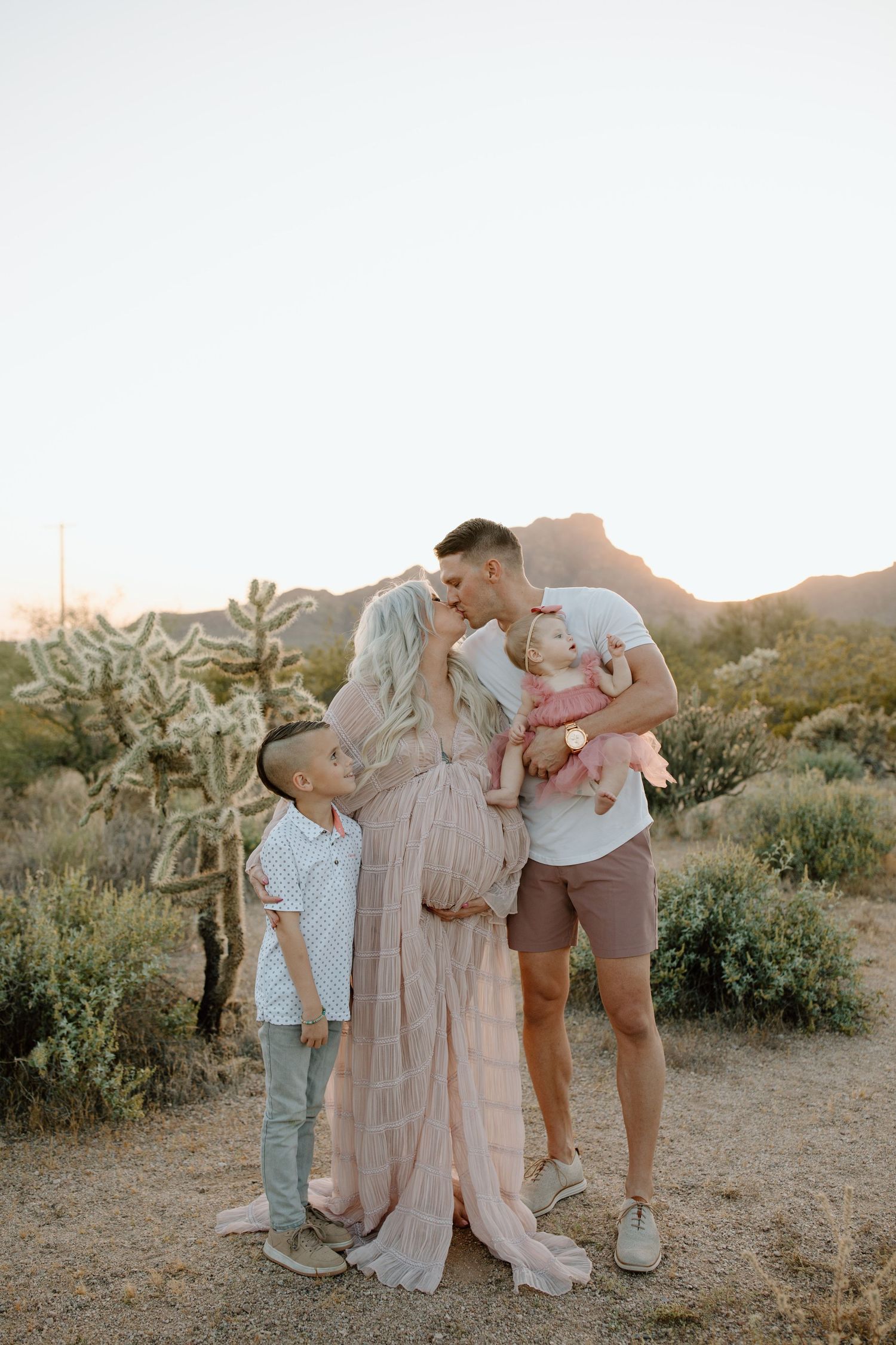 Maternity session with family included, candid moments at sunset in Arizona in the desert