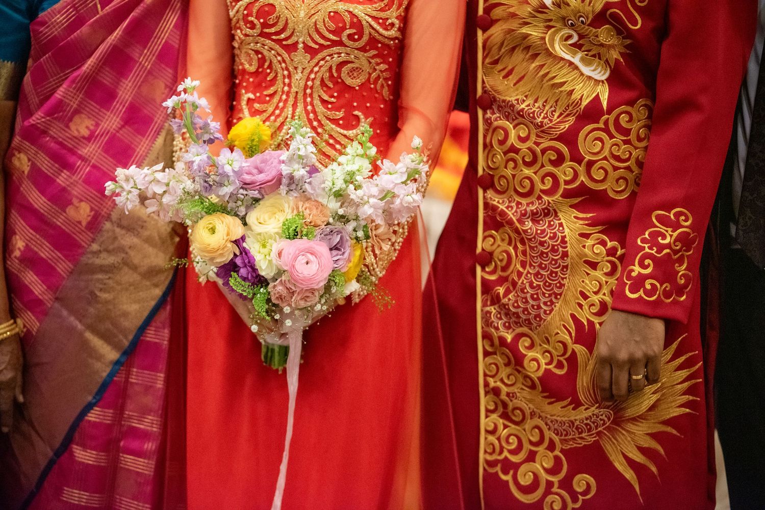 Detail shots of red and gold traditional Indian bridal attire with floral bouquet.