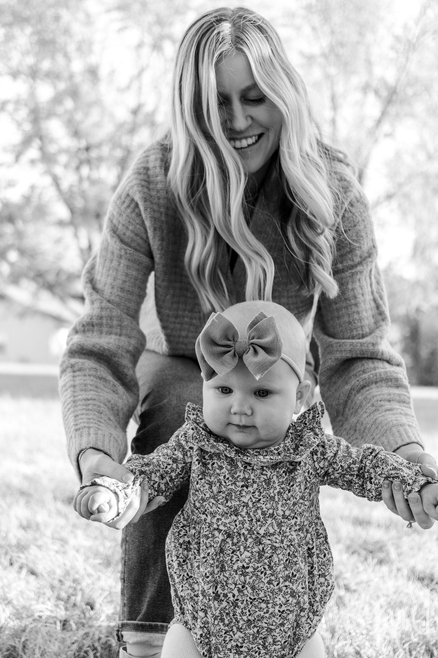 Candid moments of joy captured outdoors in black and white photography.