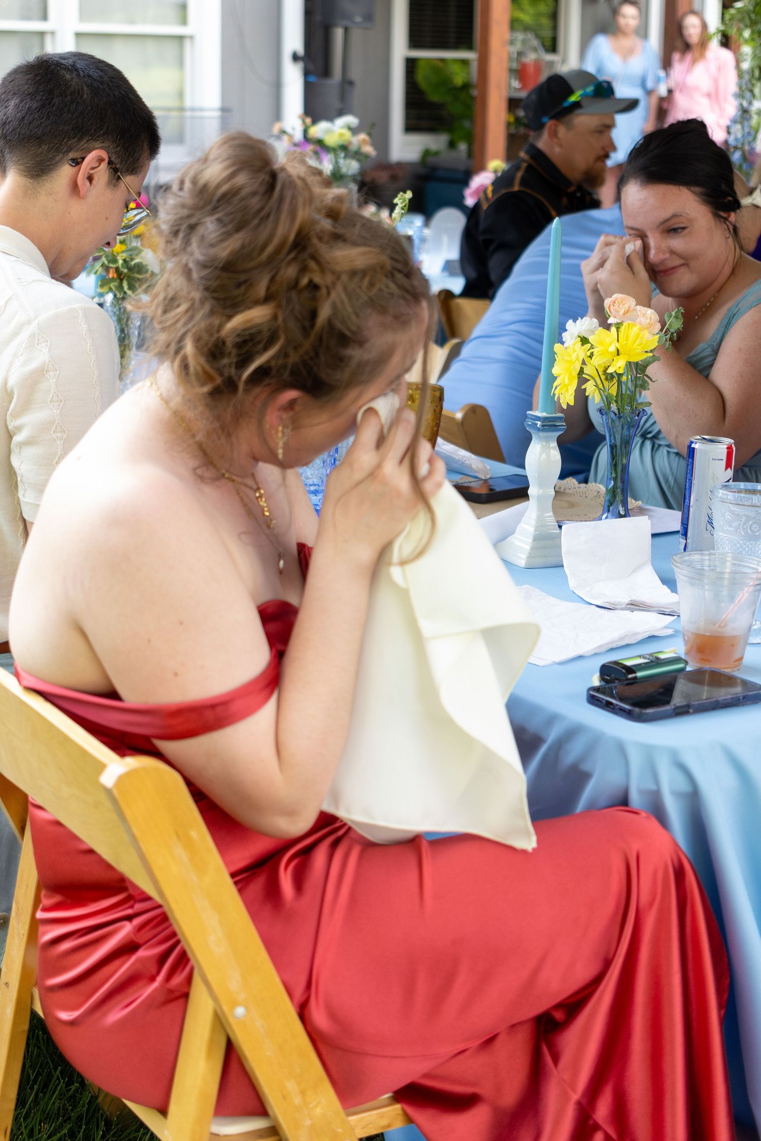 Emotional moment between loved ones during a father daughter dance at a wedding.