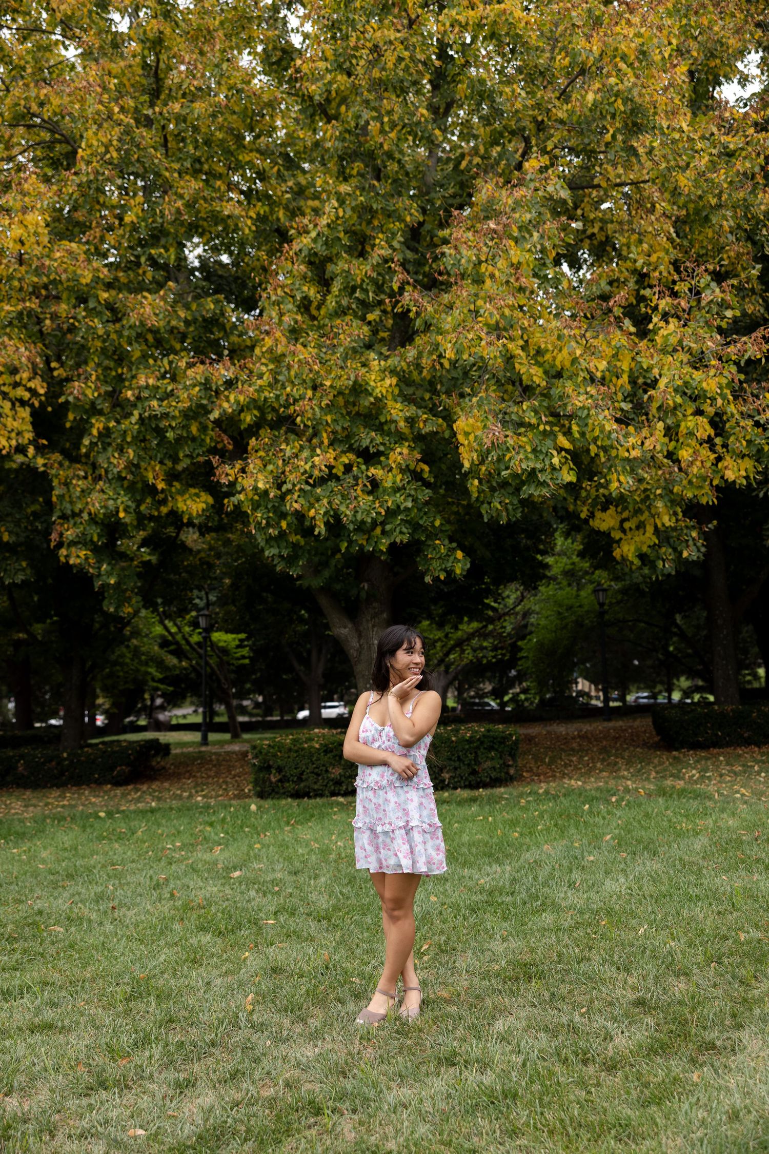 Senior posing in the park at Nelson Atkins Museum