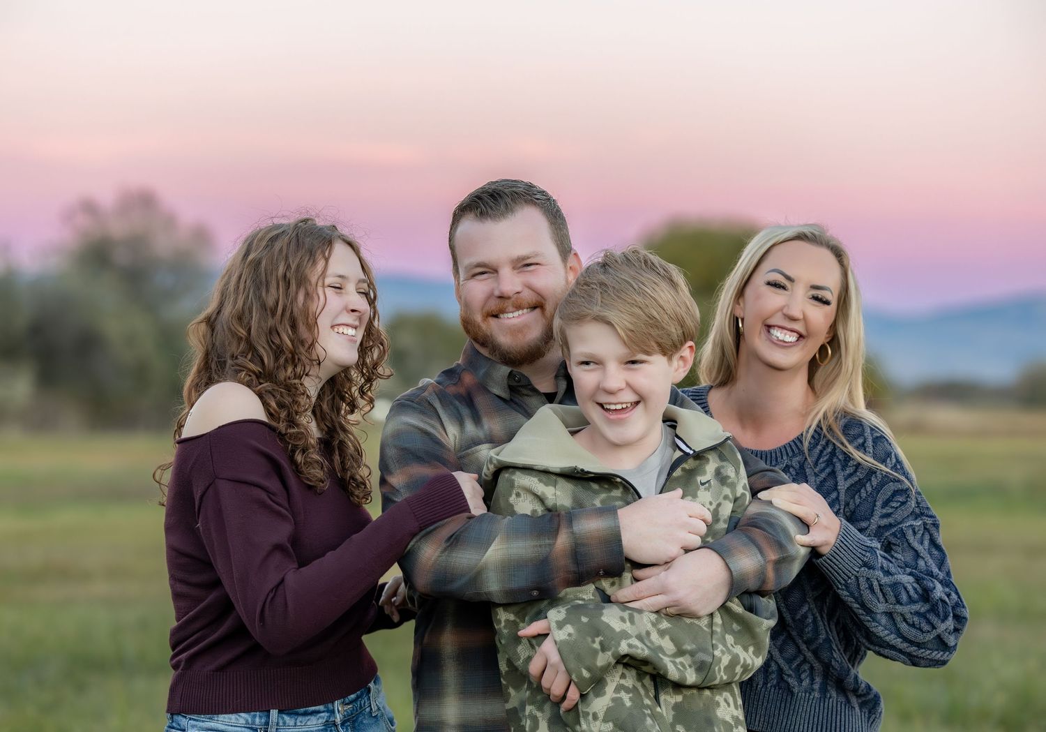 A series of candid outdoor family photos showing joyful interactions and laughter against a natural landscape at sunset.