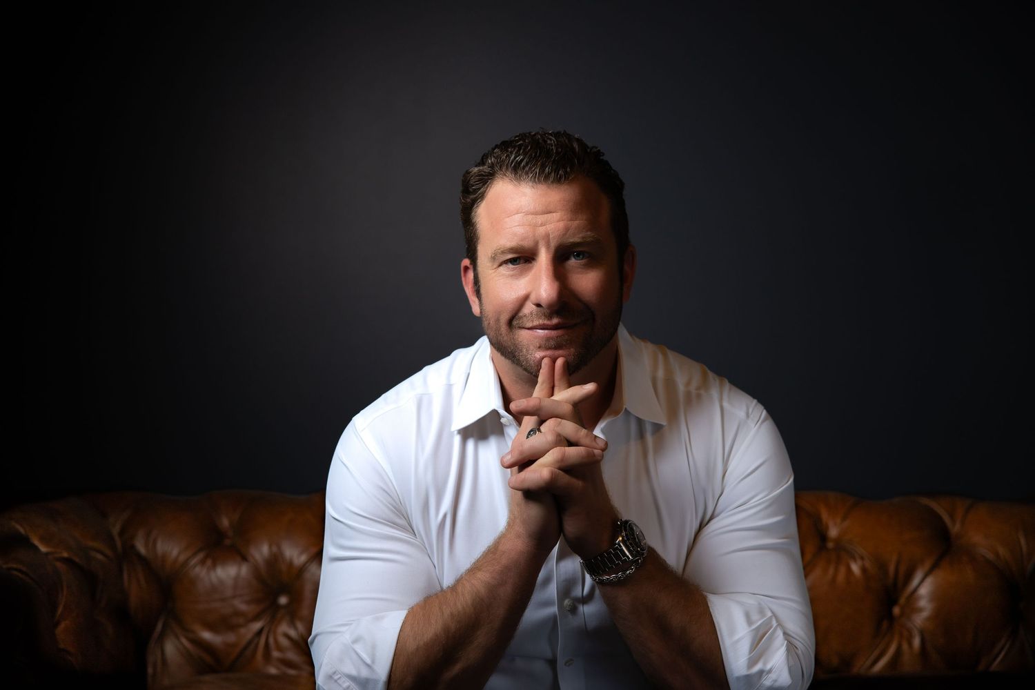 A sequence of moody portraits showing a person in a white t-shirt against a dark background with dramatic lighting.