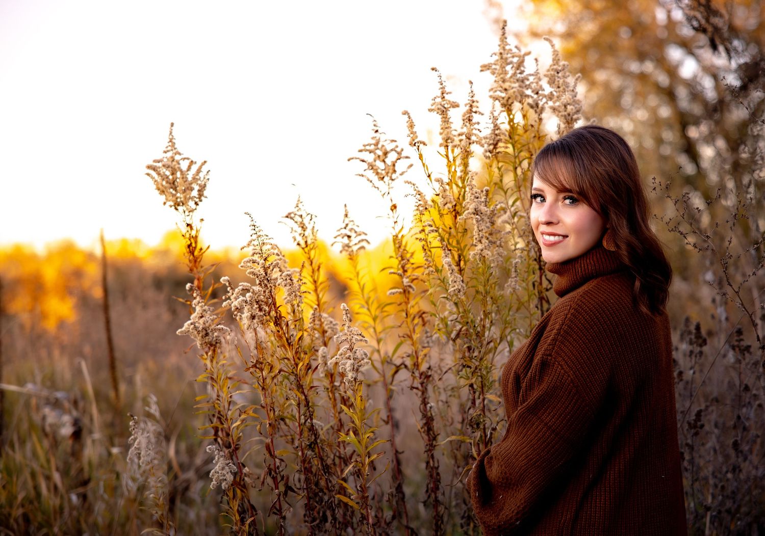 A series of golden hour portraits showing a person among autumn foliage at sunset.