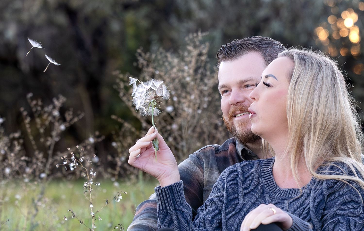 A series of connected photos shows someone blowing dandelion seeds into the air at sunset.