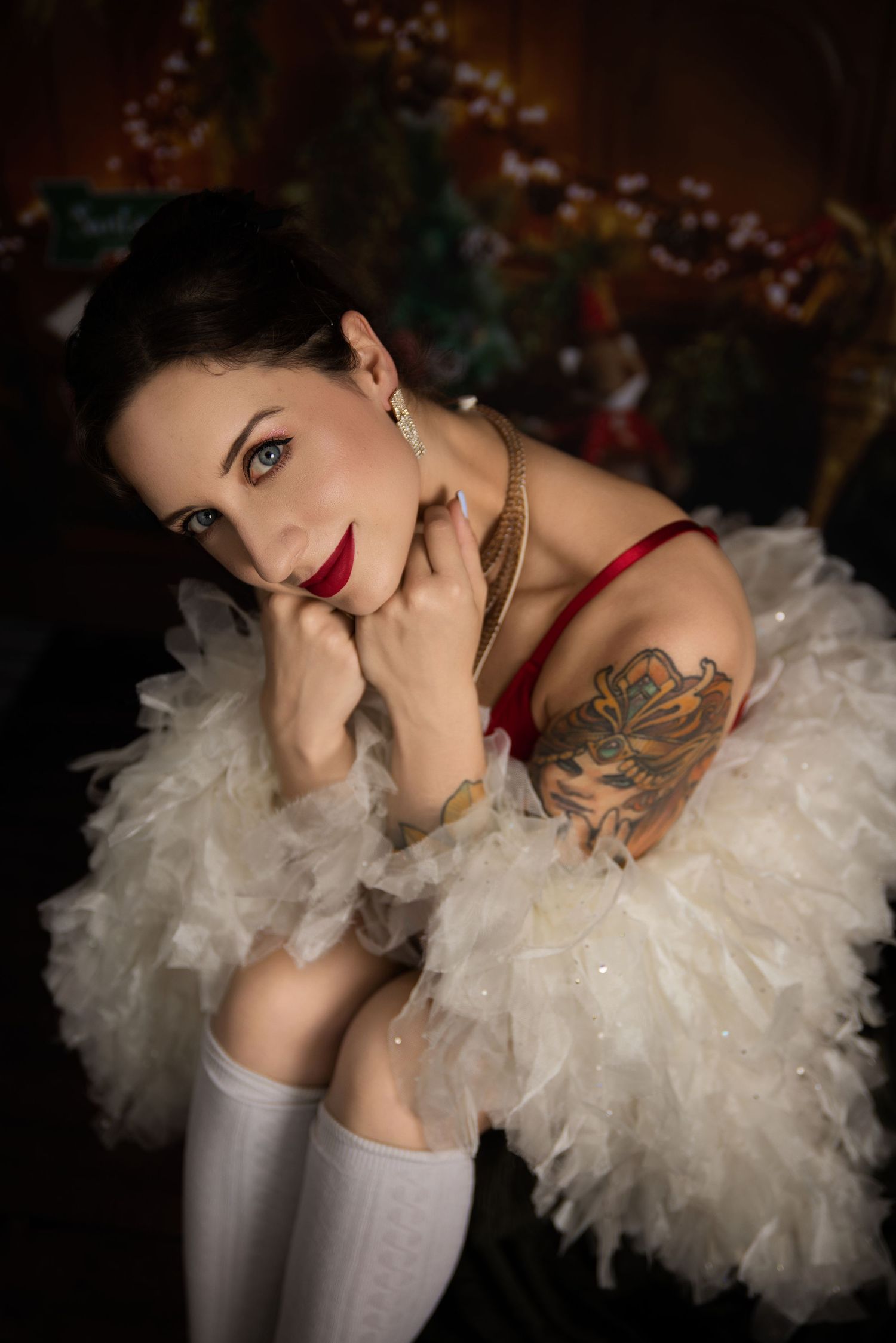 Glamour portrait series featuring decorative tulle sleeves and elegant beauty styling against dark background.