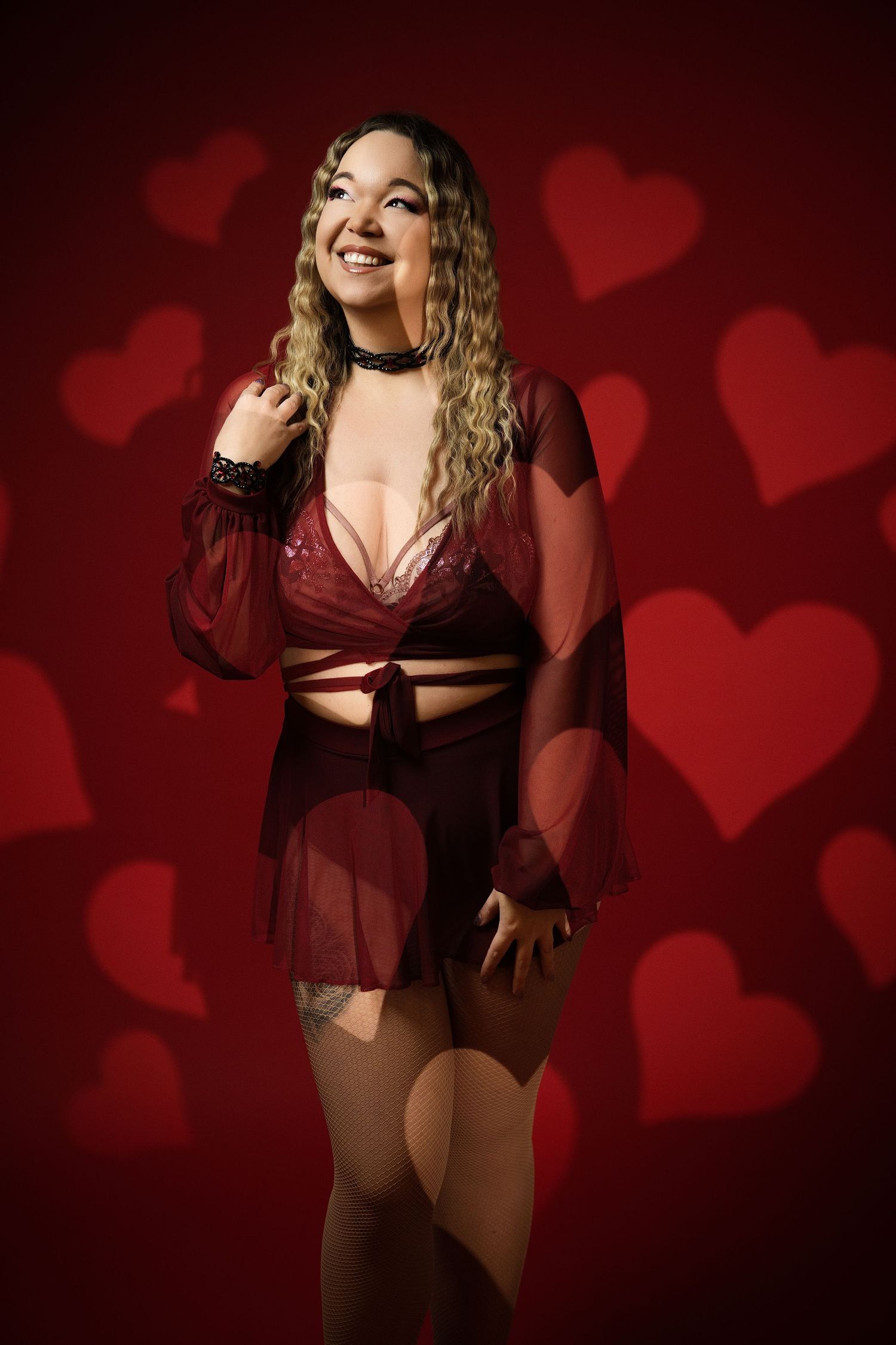 A boudoir photo series with red heart backdrop shows a woman in burgundy lingerie posing against dramatic lighting.