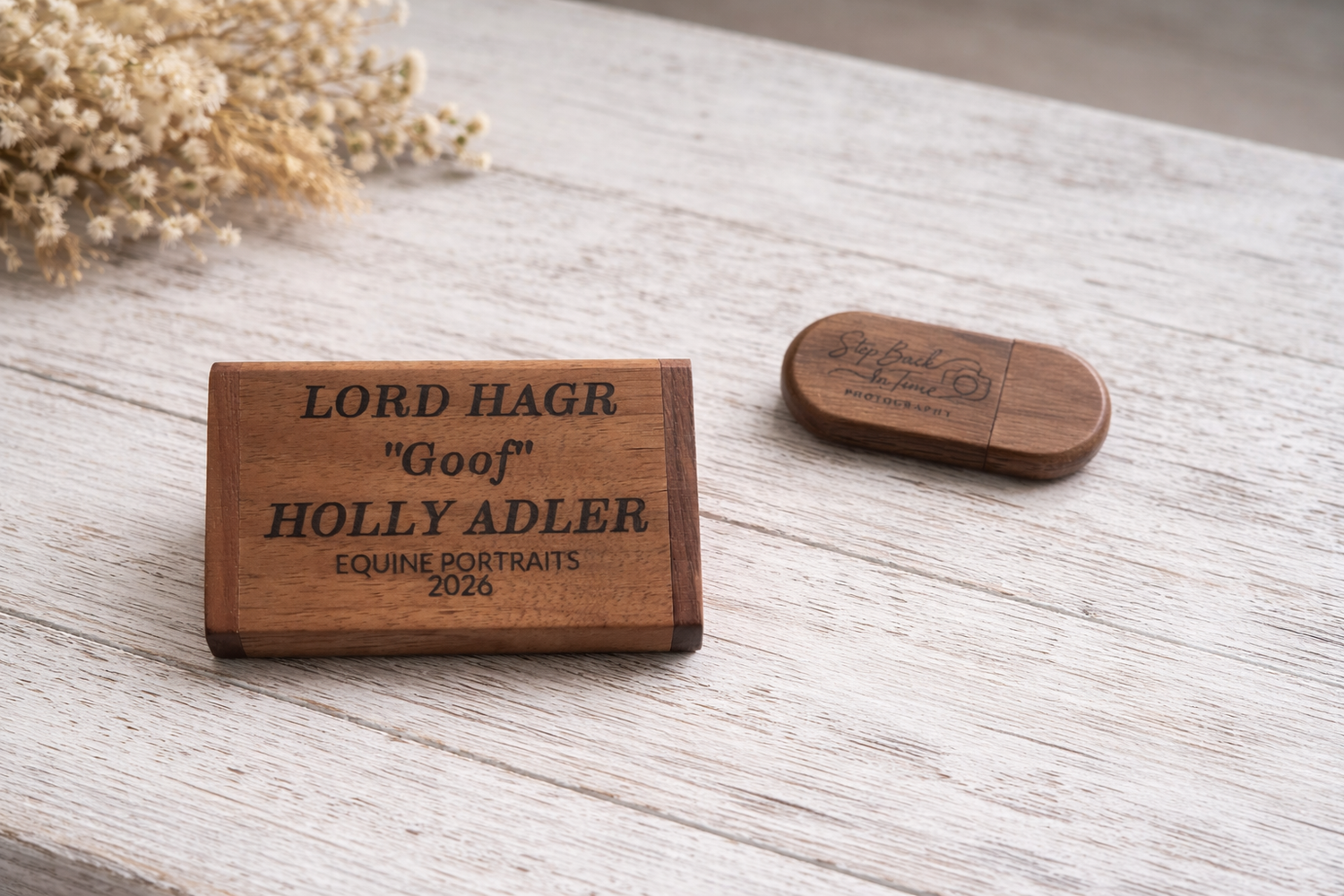 Five wooden name plates with engraved text arranged in a row on a light wooden surface.