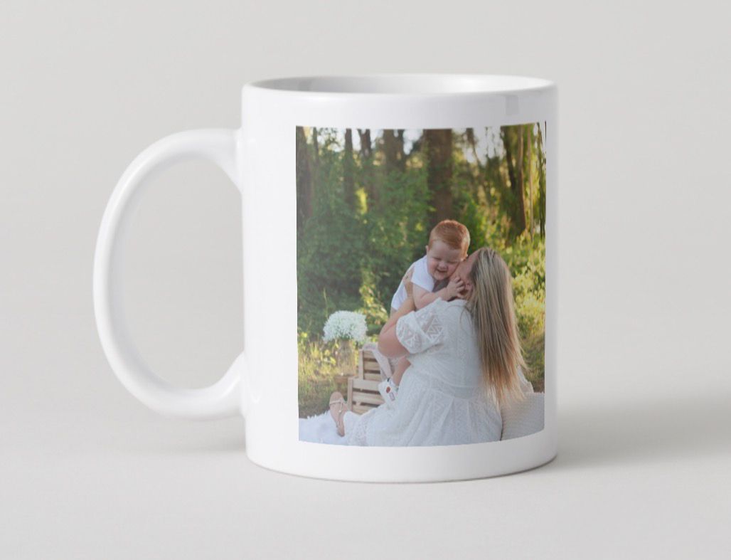 A white ceramic coffee mug with a wraparound photo print design shown from multiple angles on a light gray background.