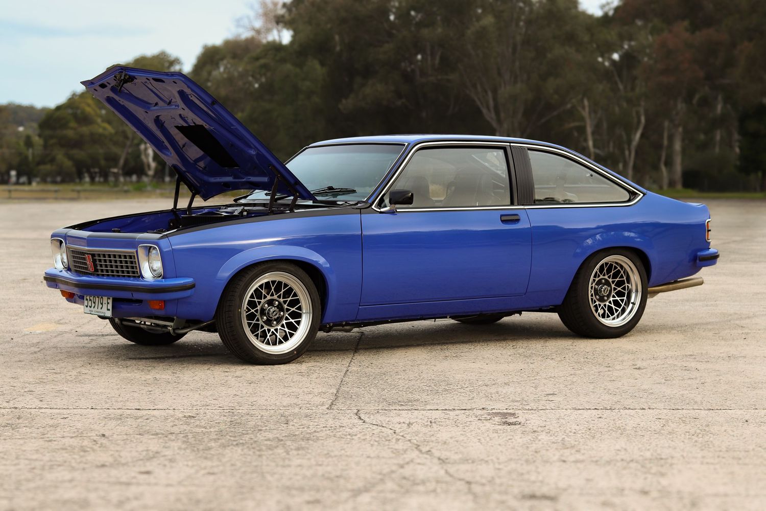 A bright blue classic torana is shown from multiple angles.