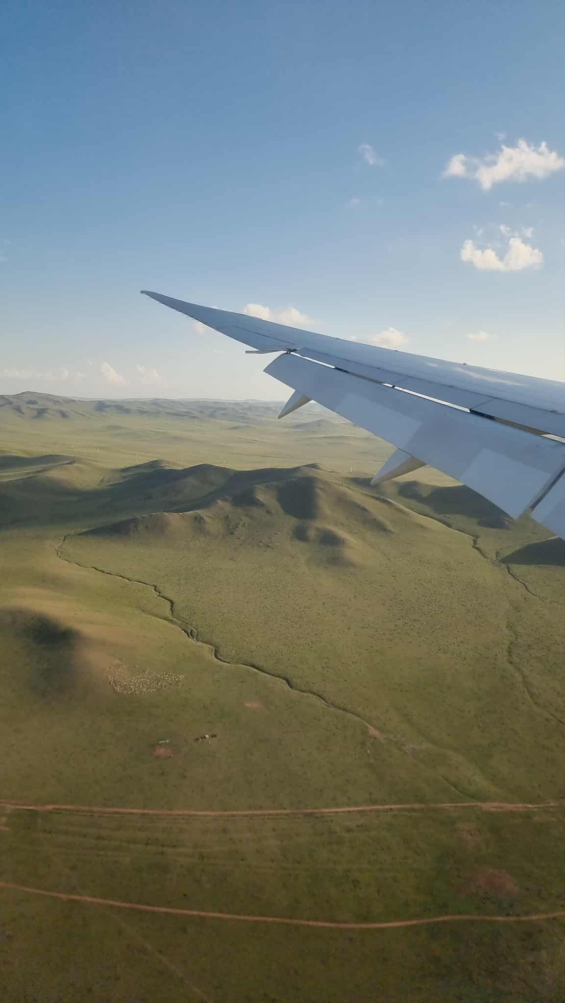 View of the steppe from the plane on landing       © 2025 Jenna Hennessy / The Tone Curve