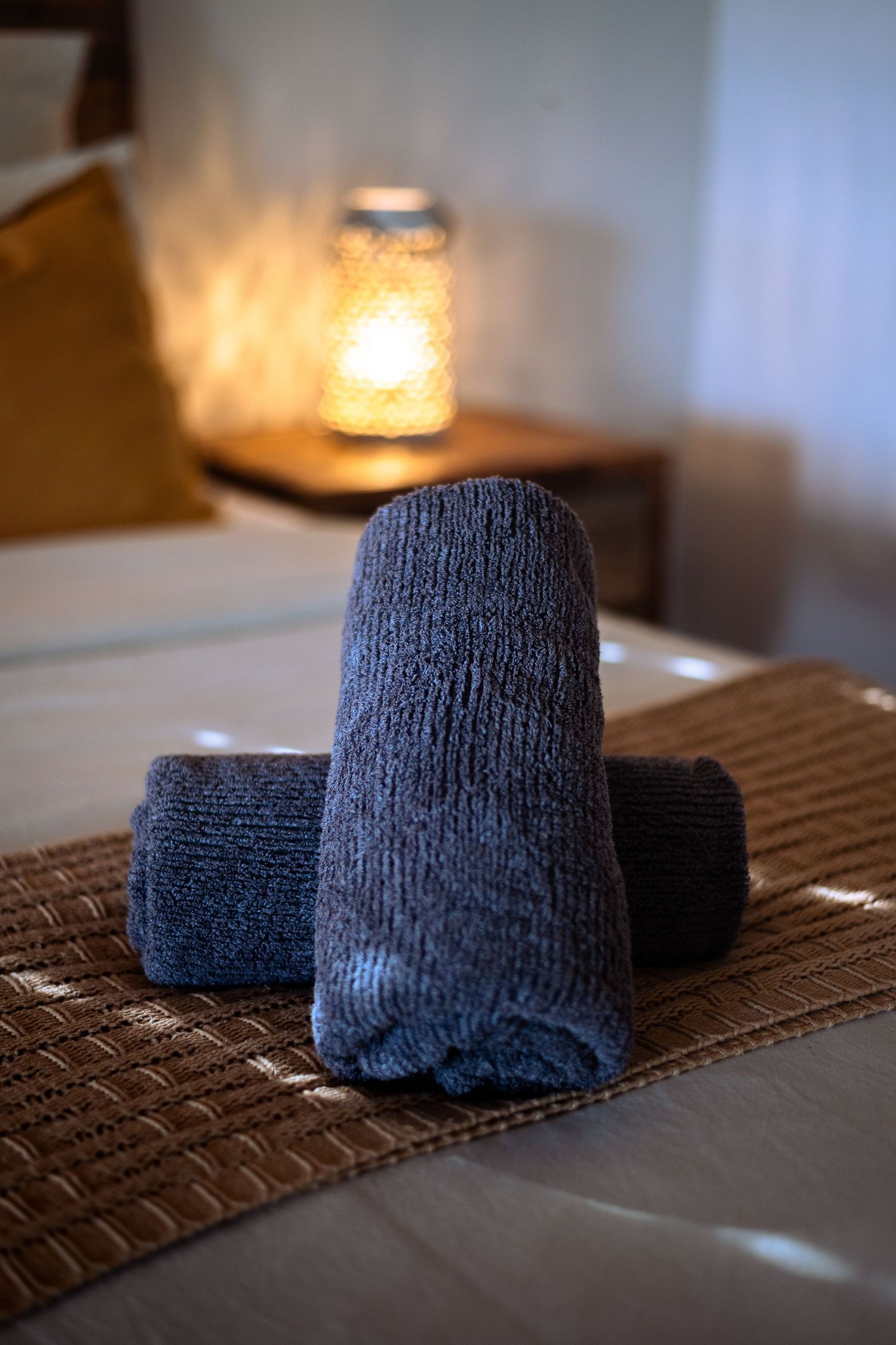 towels folded on bed of a luxe stay, air bnb, Mareeba cairns air bnb photographer, boutique accommodation