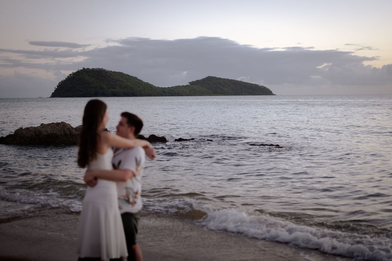 Engaged couple by the ocean. The Tone Curve Cairns copyright