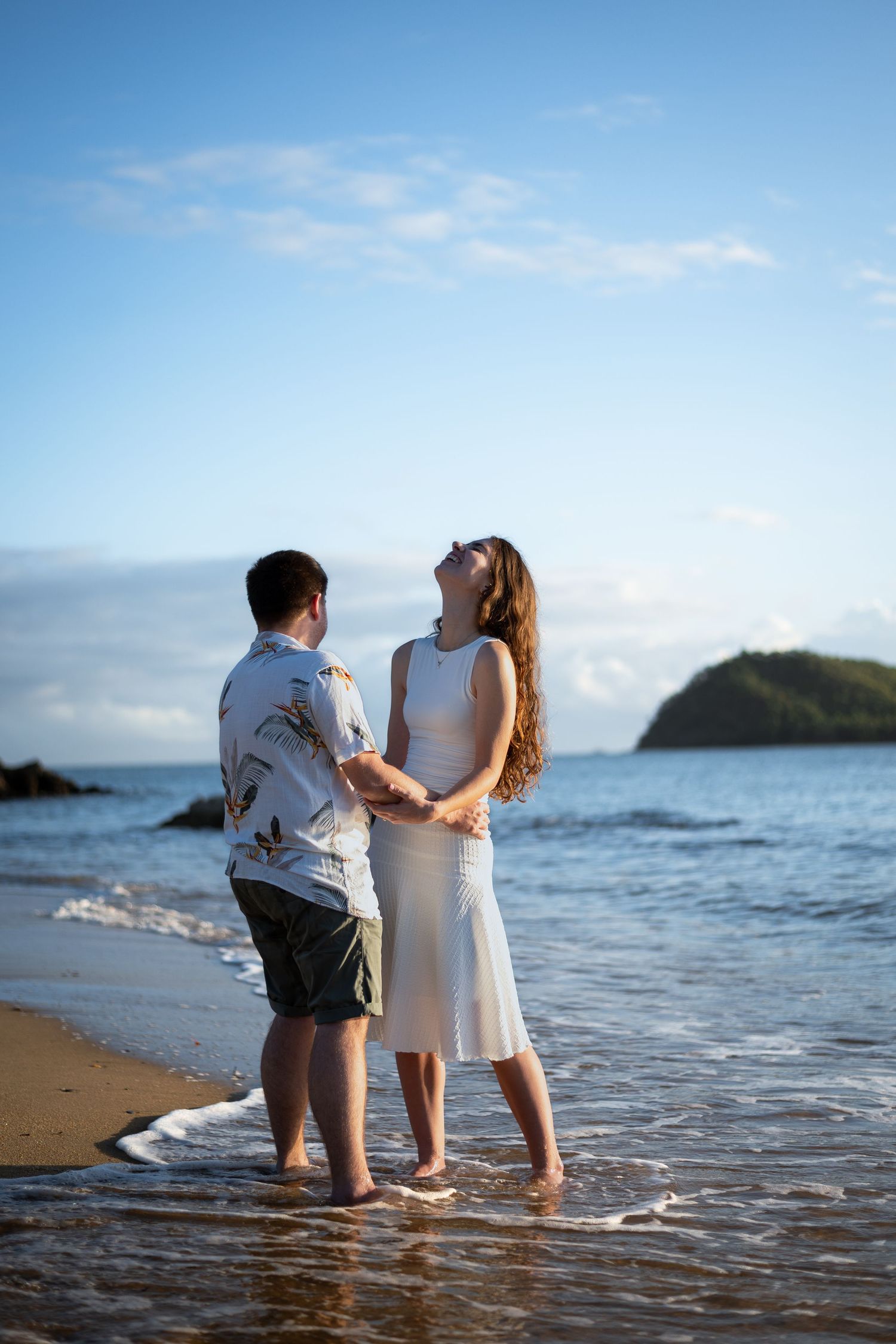 engaged couple at the beach at sunrise. The Tone Curve Cairns