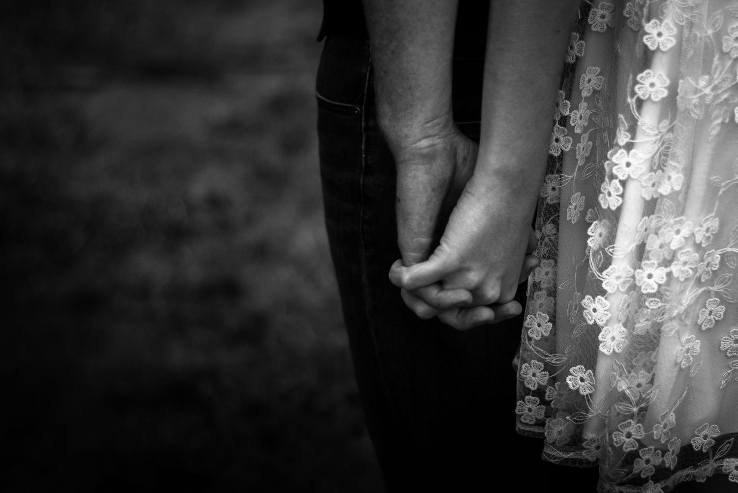 couple holding hands, cairns © 2025 Jenna Hennessy / The Tone Curve