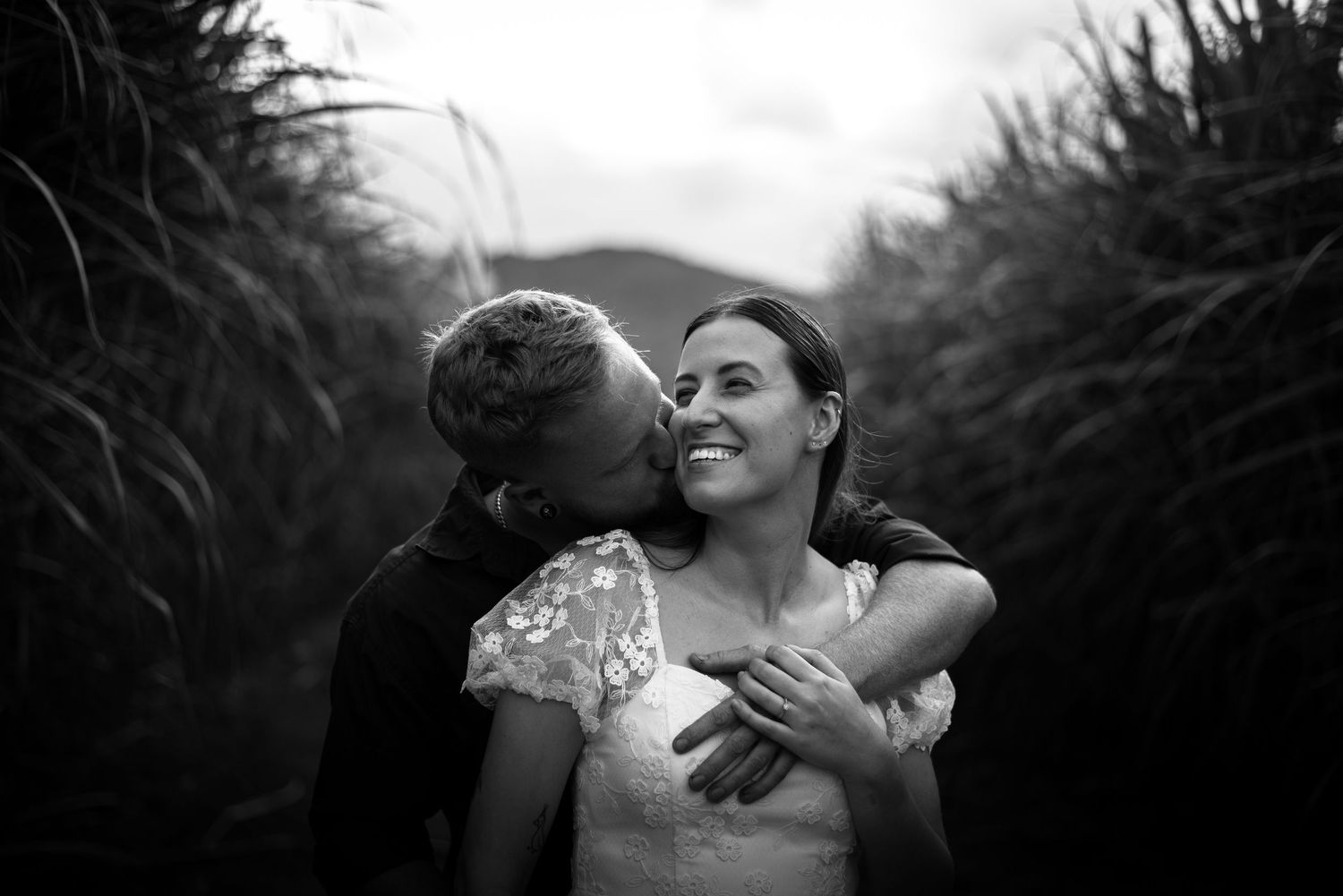 Couple kissing and cuddling in a cane field, cairns  © 2025 Jenna Hennessy / The Tone Curve