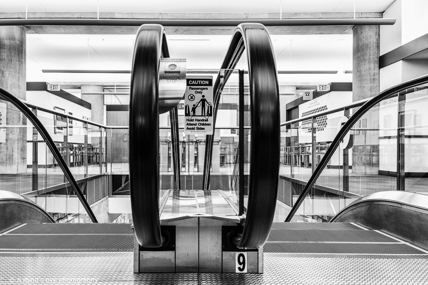 B&W interior photo, building, graphical image,  eyes, pattern, light, shadows, texture, details, abstract, support, escalator