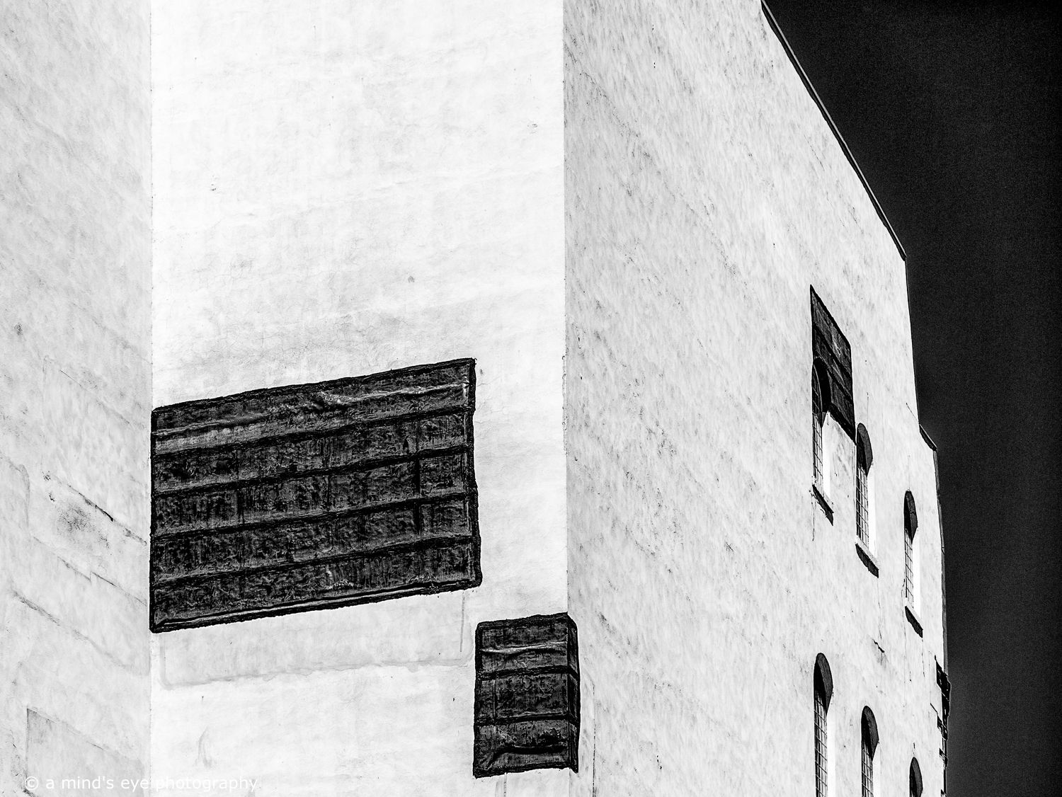 B&W architectural photo, building, graphical image,  eyes, pattern, light, shadows, texture, details, abstract