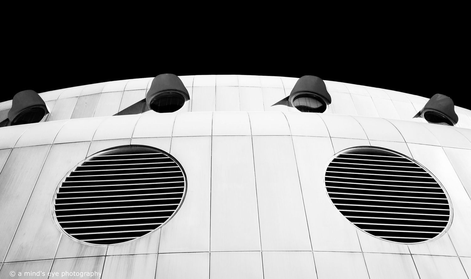 B&W architectural photo, building, graphical image,  eyes, pattern, light, shadows, texture, details