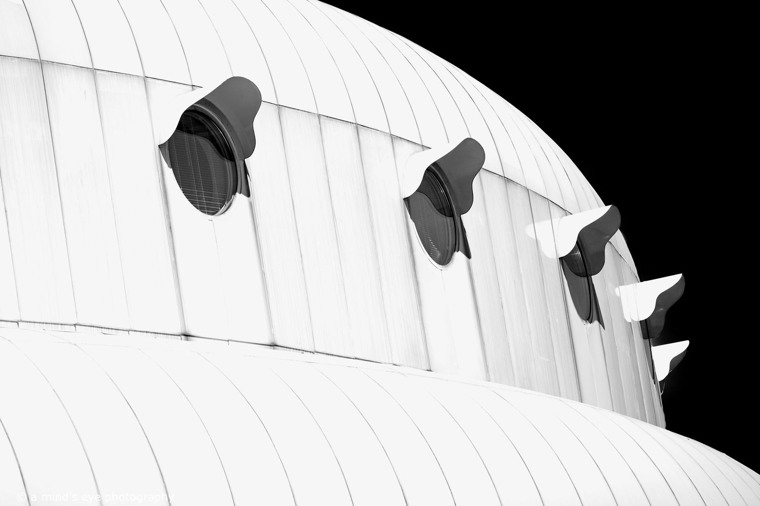 B&W architectural photo, building, graphical image,  eyes, pattern, light, shadows, texture, details, abstract