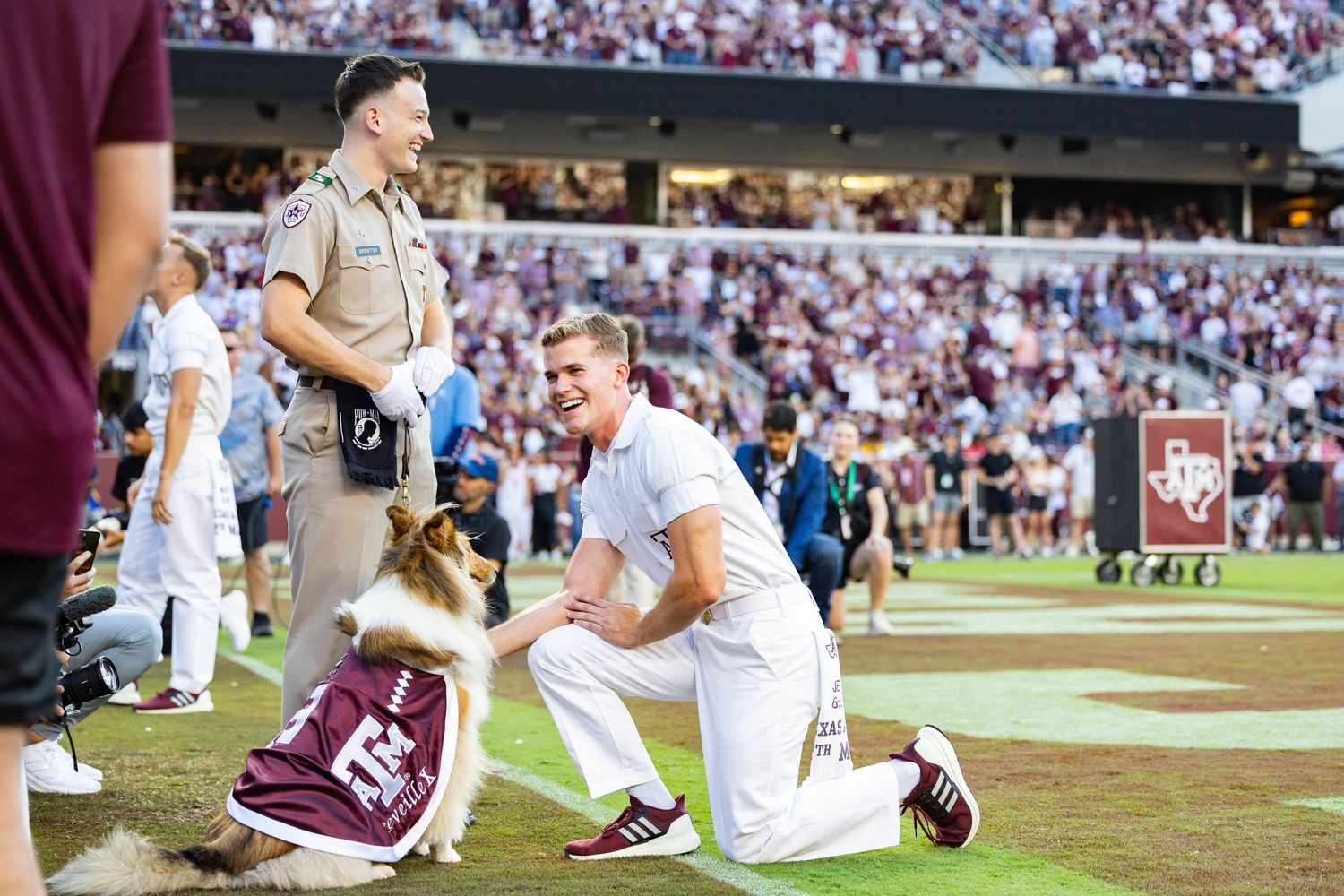 Reveille X with head yell leader, Jake Carter, during the TAMU vs McNeese football game.