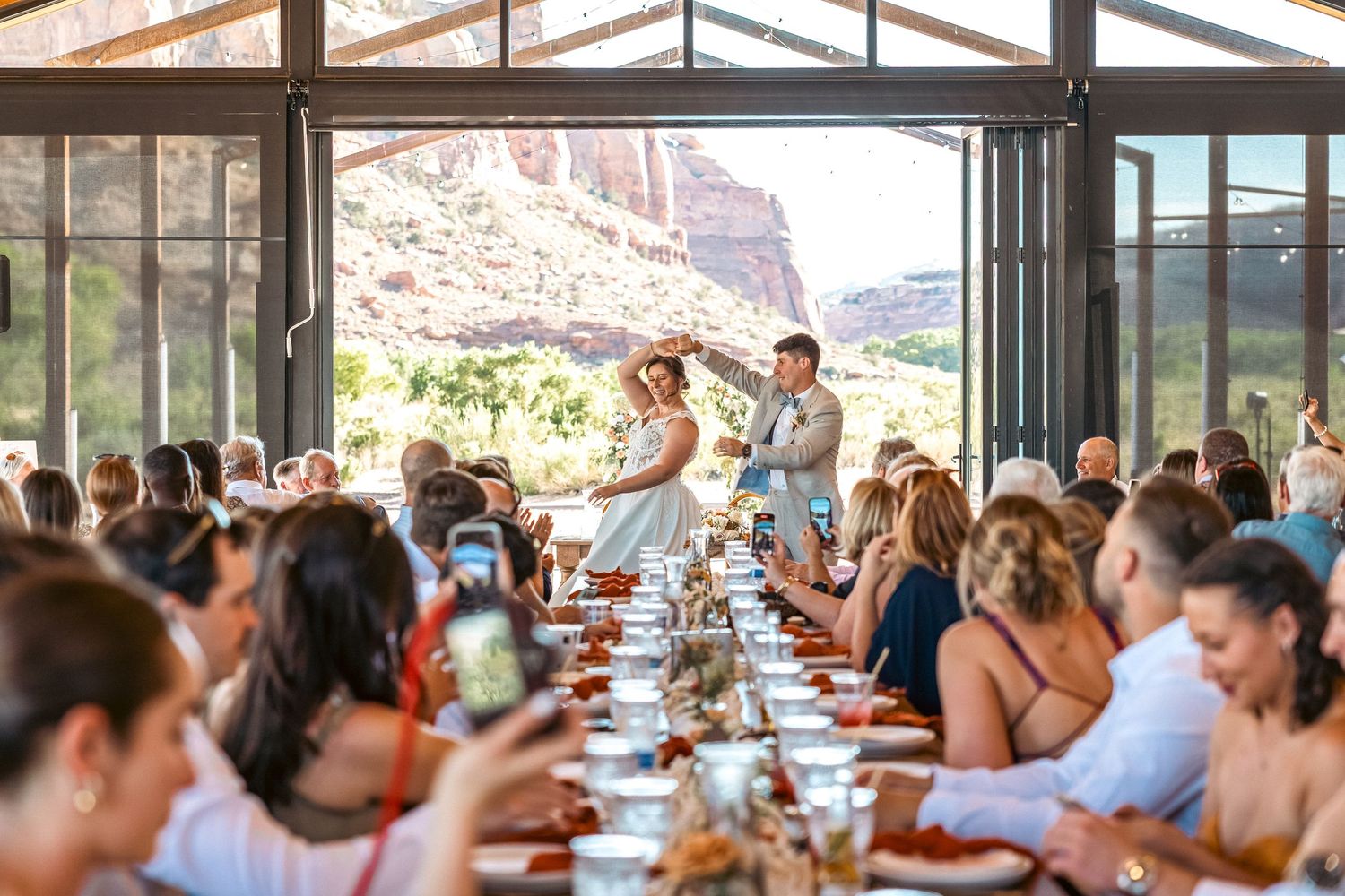 Newly weds dancing in front of their guests in Moab, Utah.