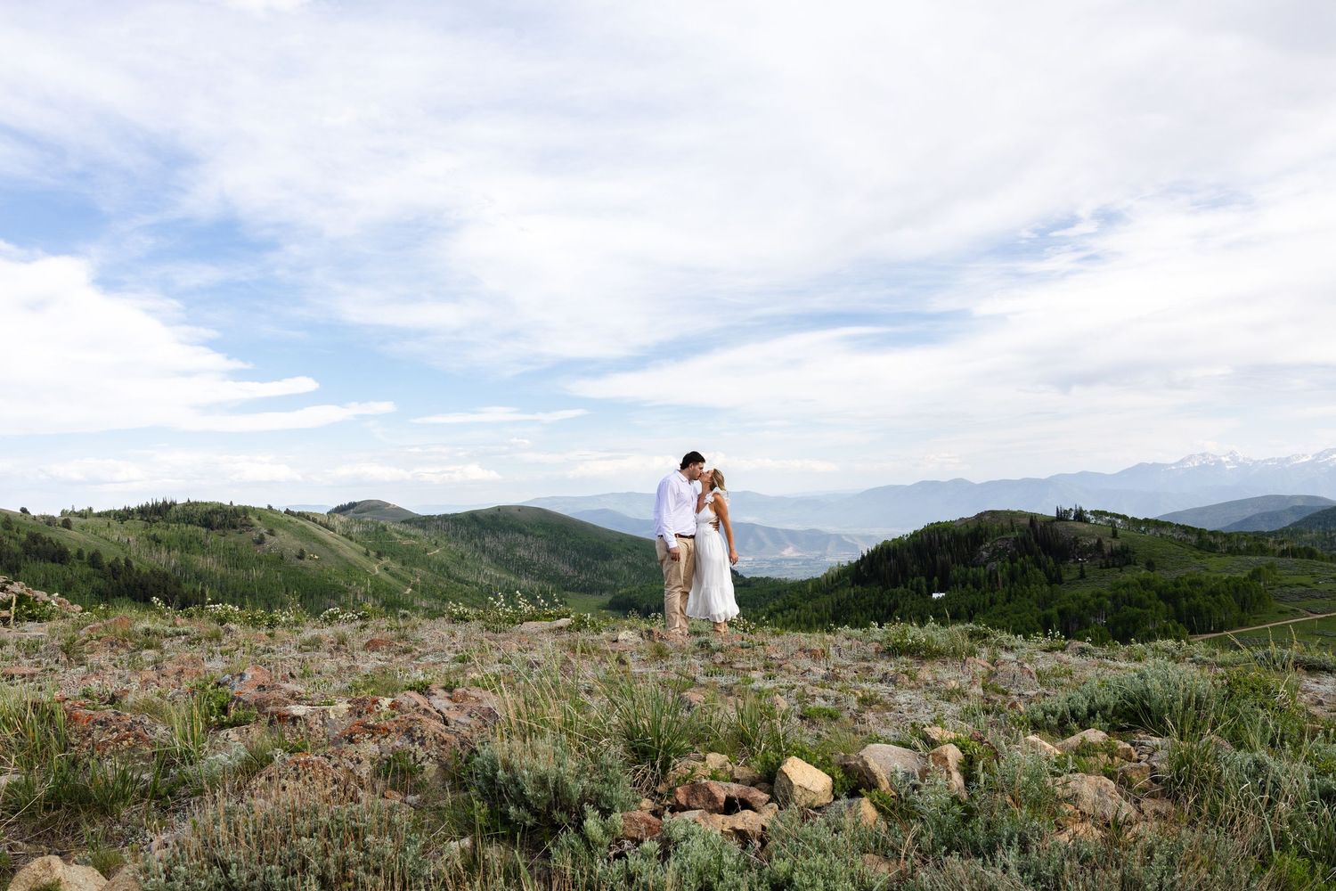 A couple kissing on top of Empire Pass in Park City, Utah.