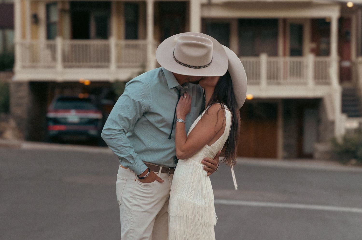 A couple kissing on the Main Street in Park City.