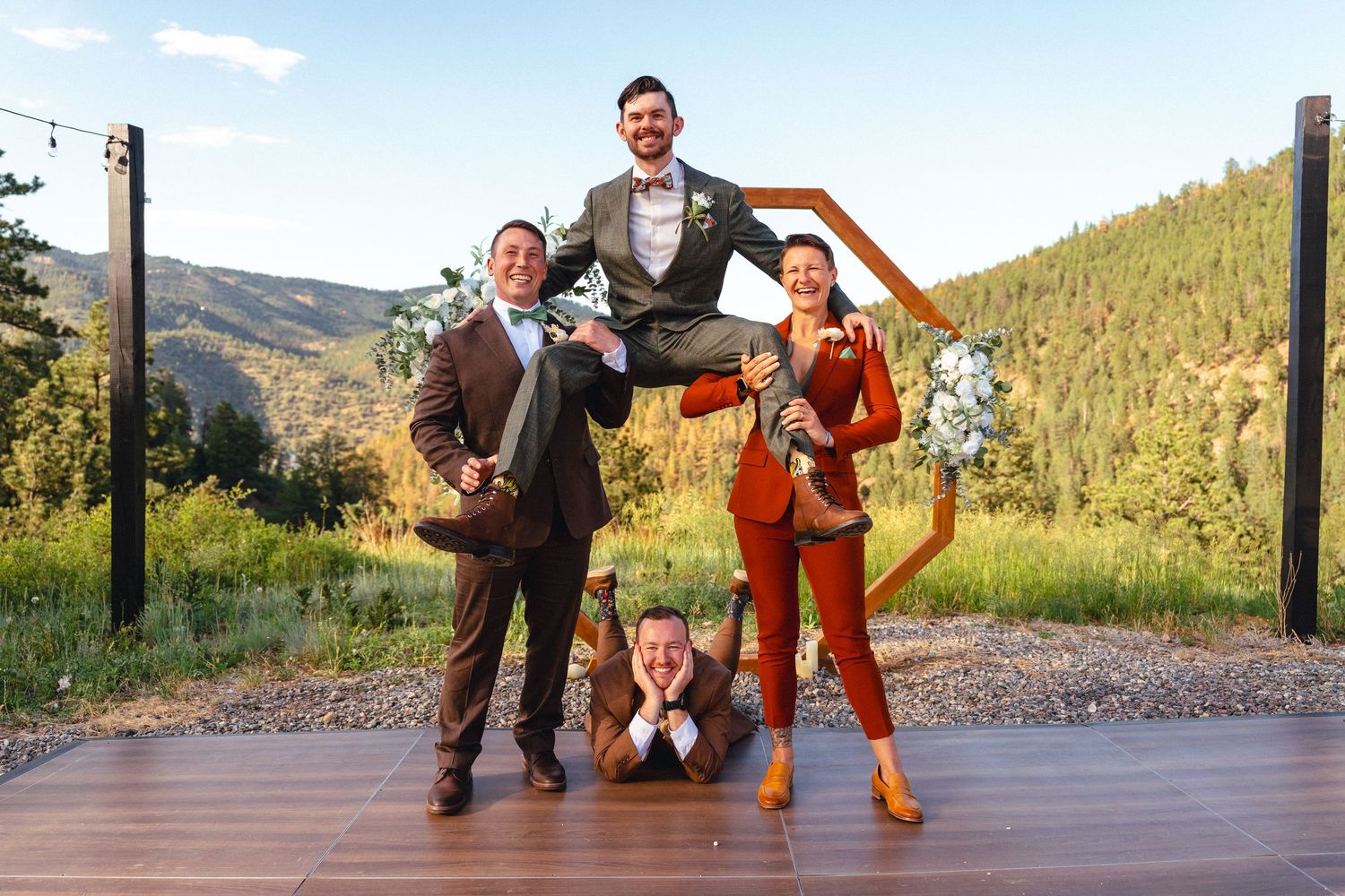 A band plays acoustic instruments on a mountain path during sunset, creating an outdoor musical performance.