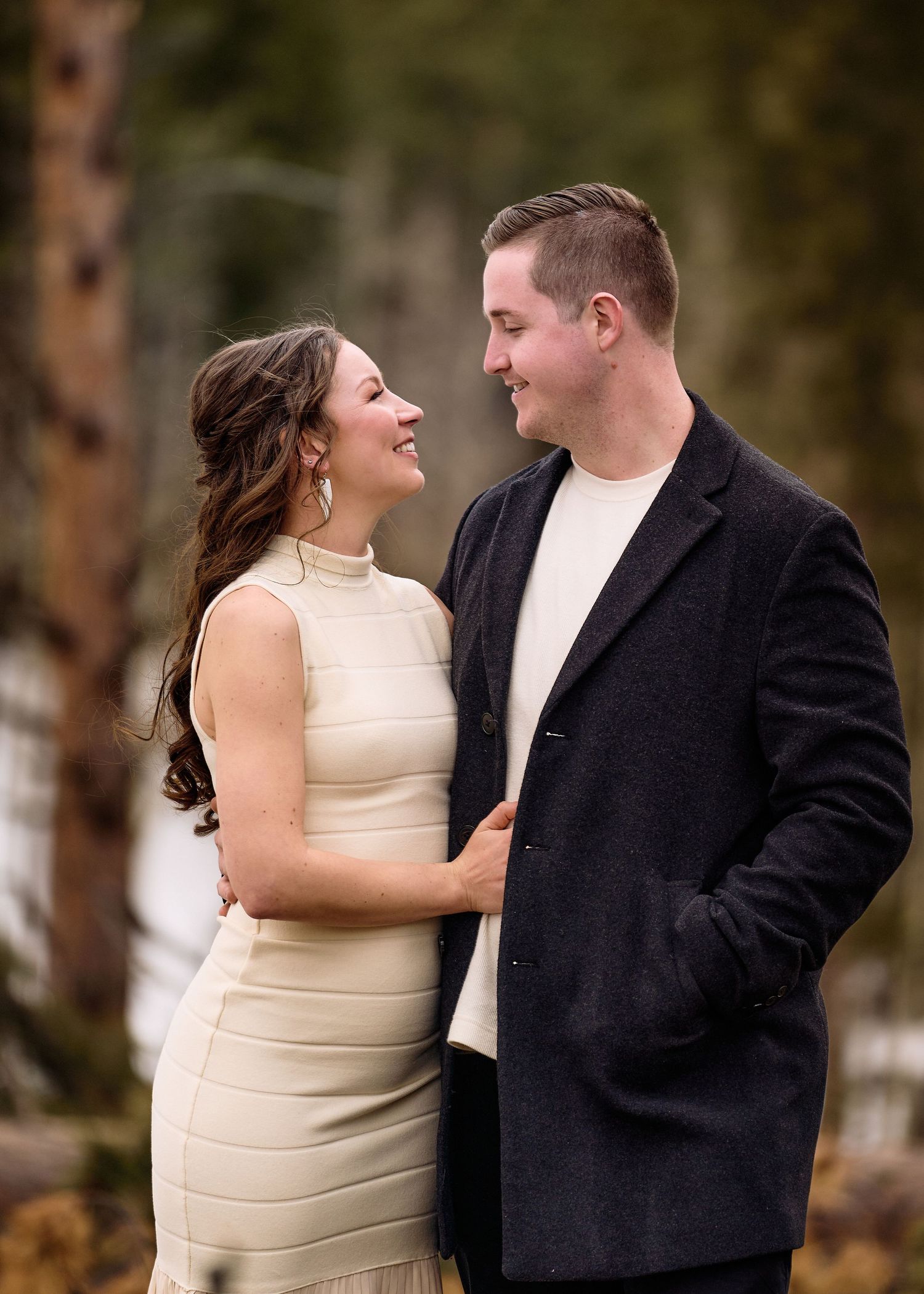 Couple sharing intimate moment together during outdoor photoshoot.