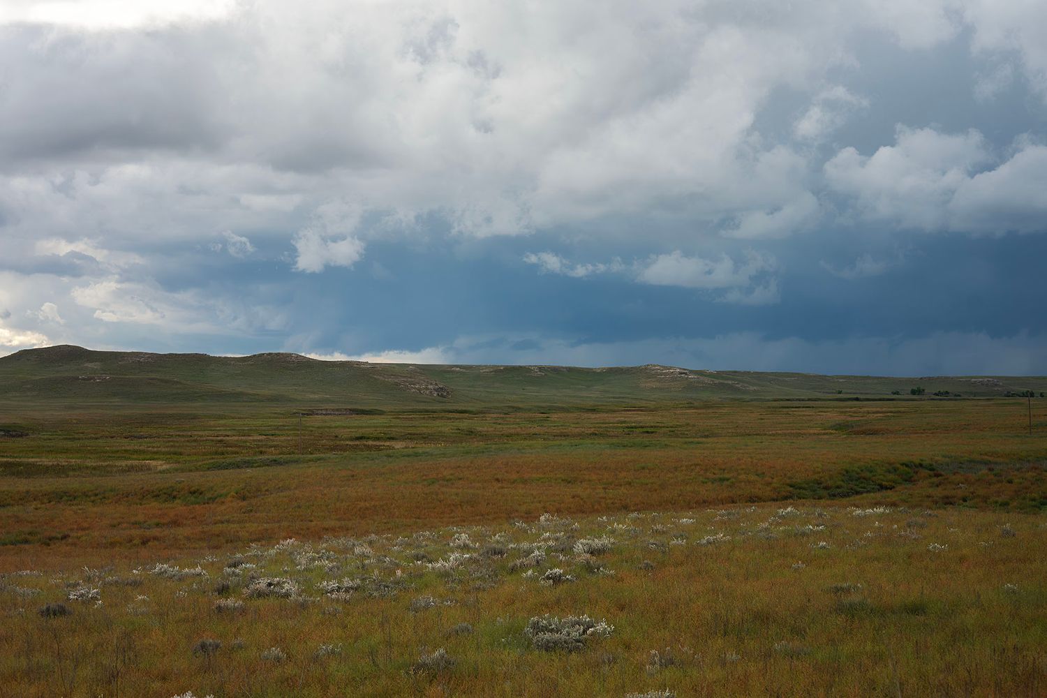 Open prairie and changing storm clouds at Agate Fossil Beds National Monument before leaving
